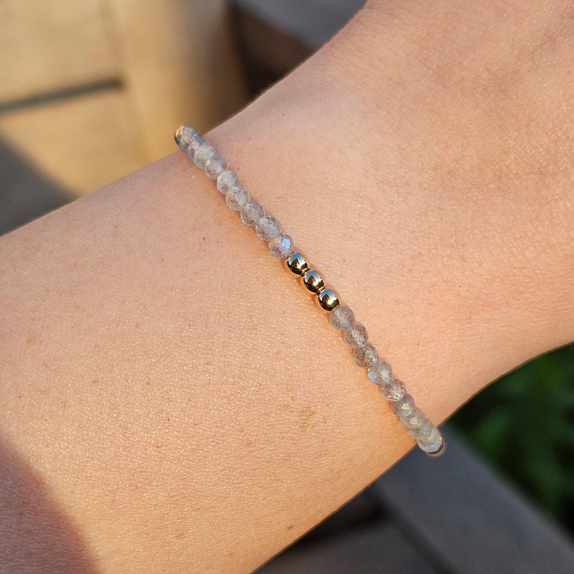 Delicate, faceted dainty Labradorite and AAA grade gold plated Hematite bead bracelet with a gold stainless steel clasp and extender chain.