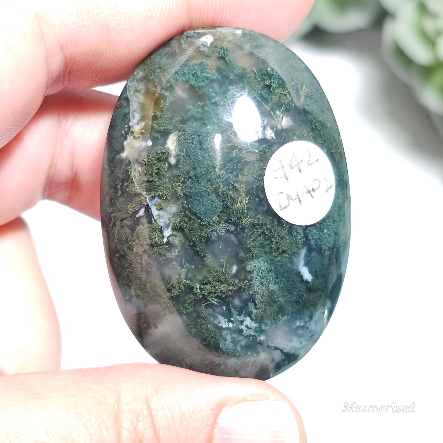 Beautiful forest green and earthy golden brown Moss Agate palm stone from Indonesia