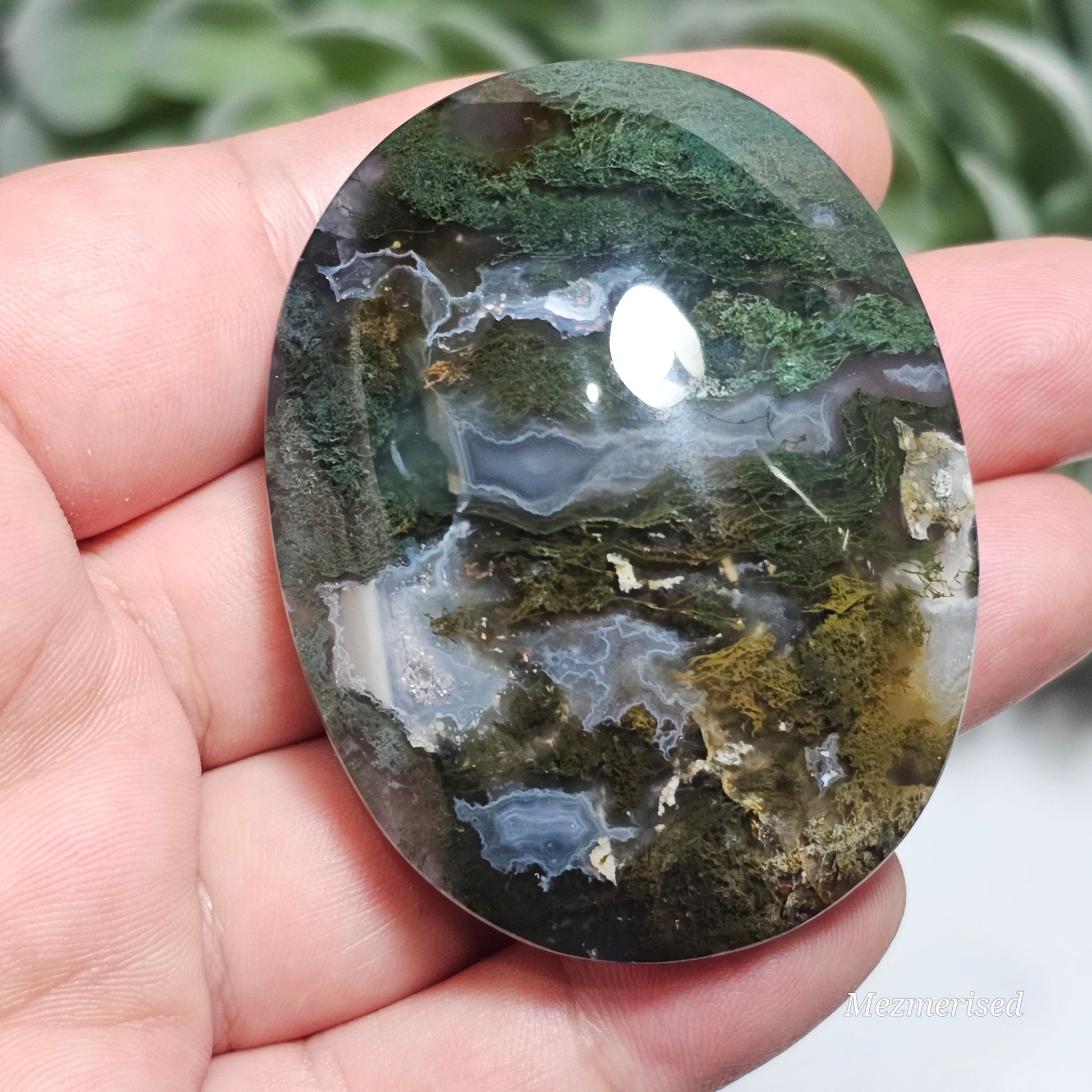 Beautiful forest green and earthy golden brown Moss Agate palm stone from Indonesia