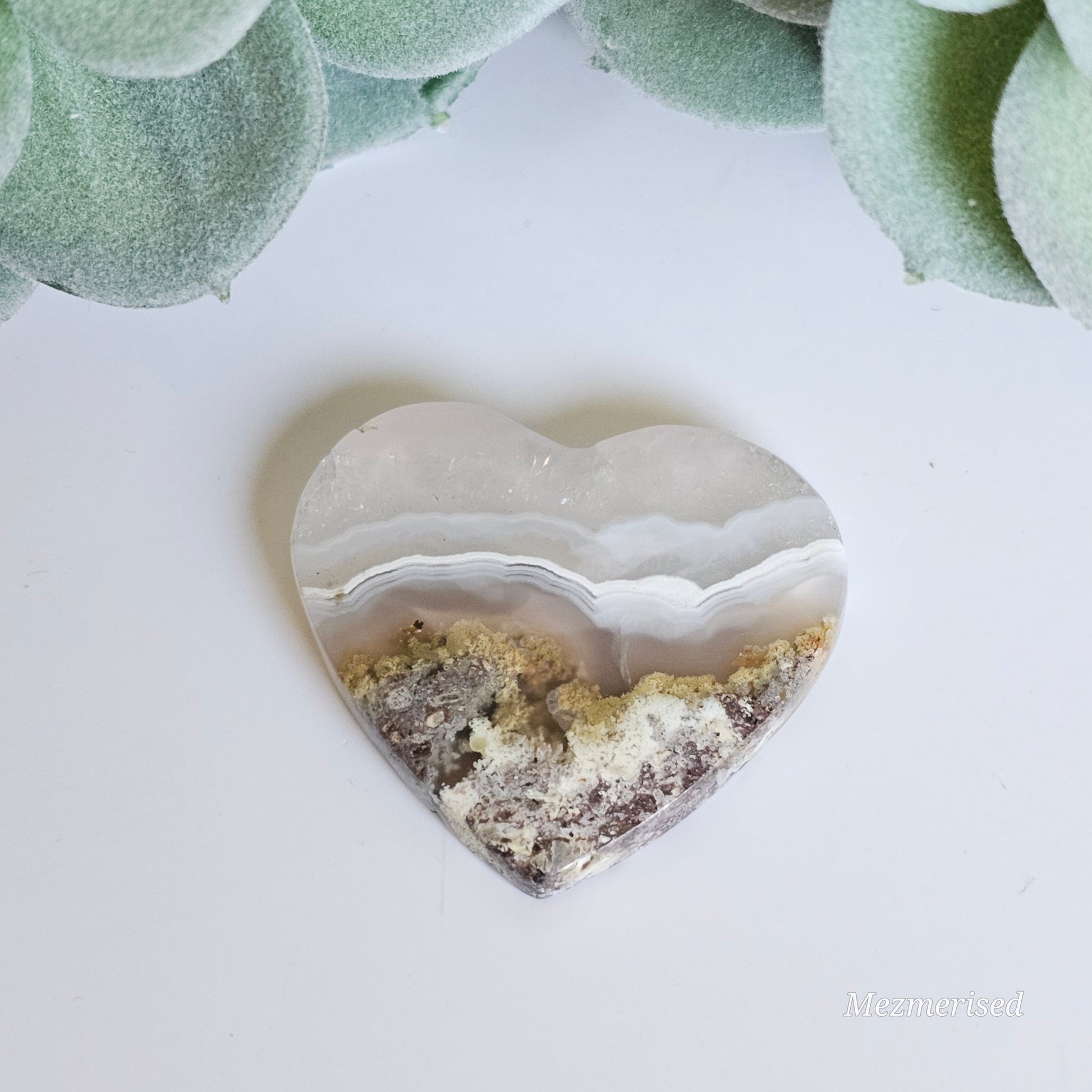 An exquisite heart carving, showcasing the alluring uniqueness of the Scenic Moss Agate which resembles nature's beautiful landscapes.