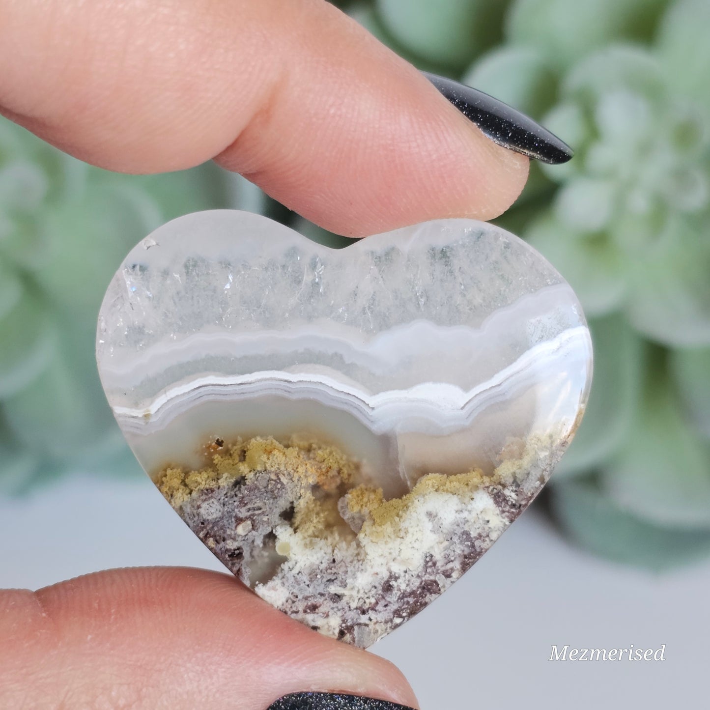 An exquisite heart carving, showcasing the alluring uniqueness of the Scenic Moss Agate which resembles nature's beautiful landscapes.