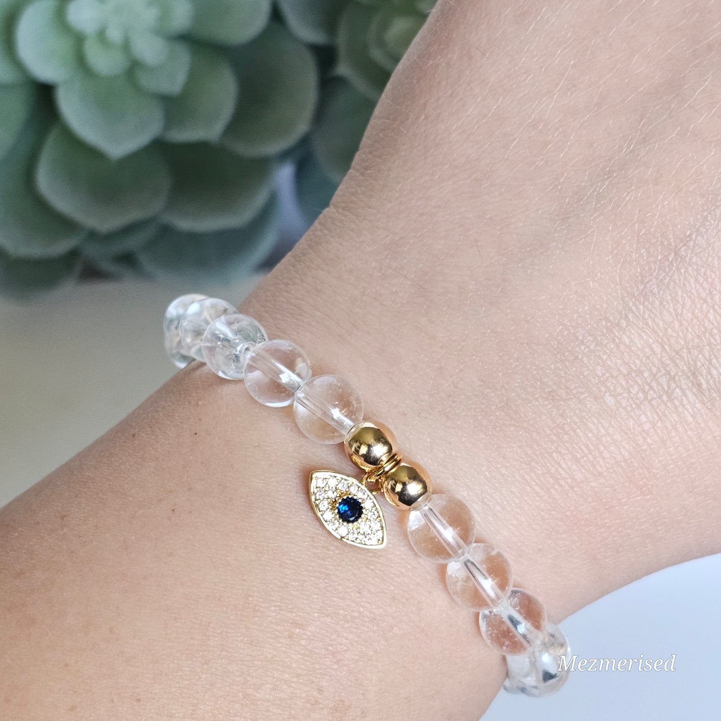 8mm A grade Clear Quartz and gold plated Hematite bead stretch bracelet with your choice of charm.