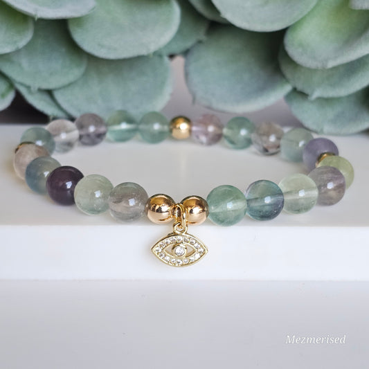 8mm A grade rainbow Fluorite and gold plated Hematite bead stretch bracelet with your choice of charm.