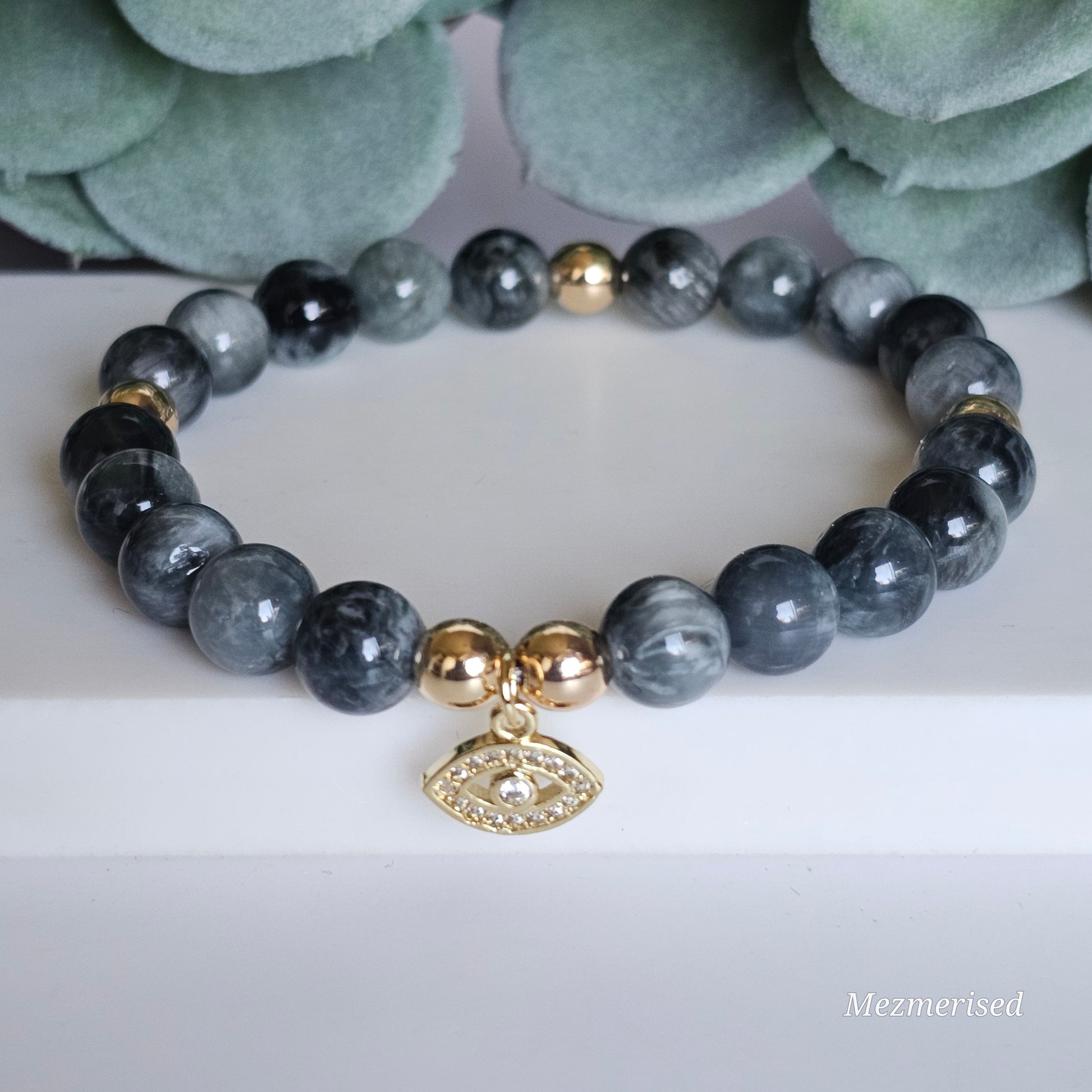 8mm Hawk's Eye and gold plated Hematite bead stretch bracelet with your choice of charm.