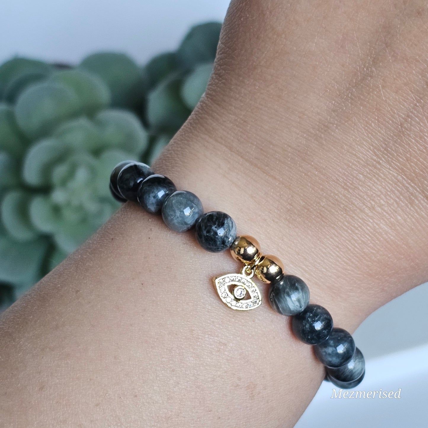 8mm Hawk's Eye and gold plated Hematite bead stretch bracelet with your choice of charm.