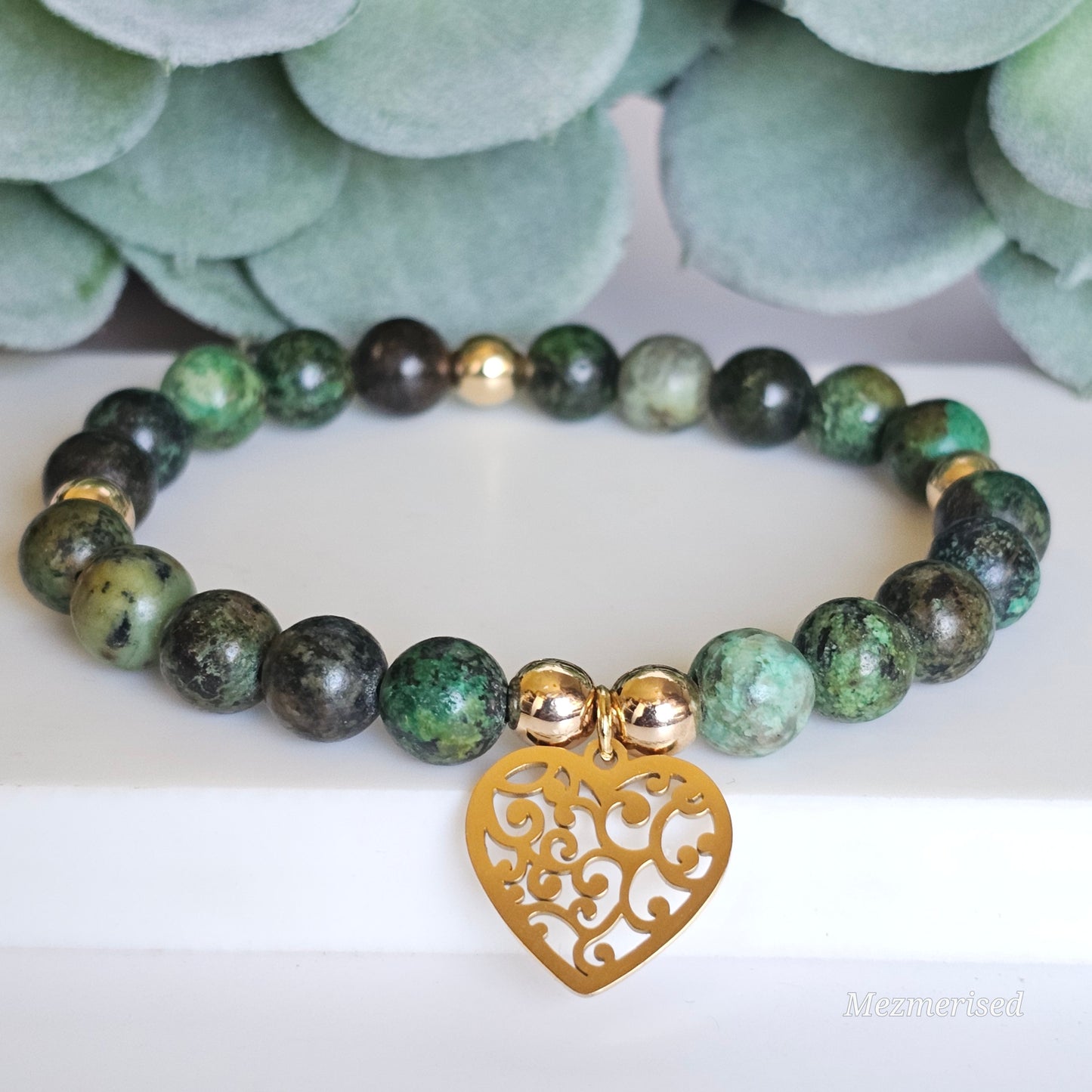 8mm African Turquoise and gold plated Hematite bead stretch bracelet with your choice of charm.