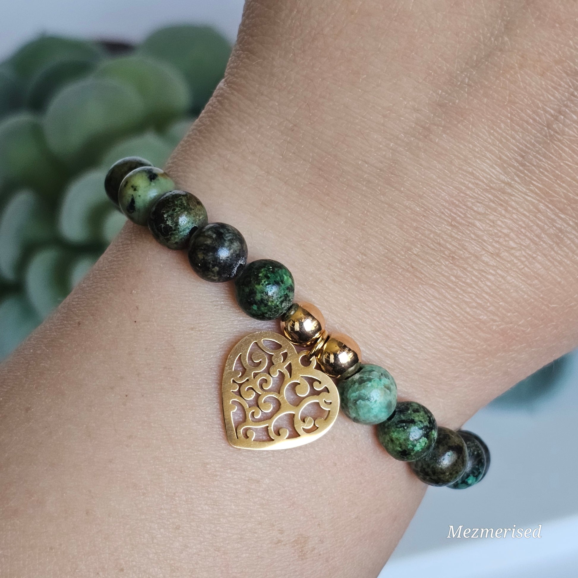 8mm African Turquoise and gold plated Hematite bead stretch bracelet with your choice of charm.