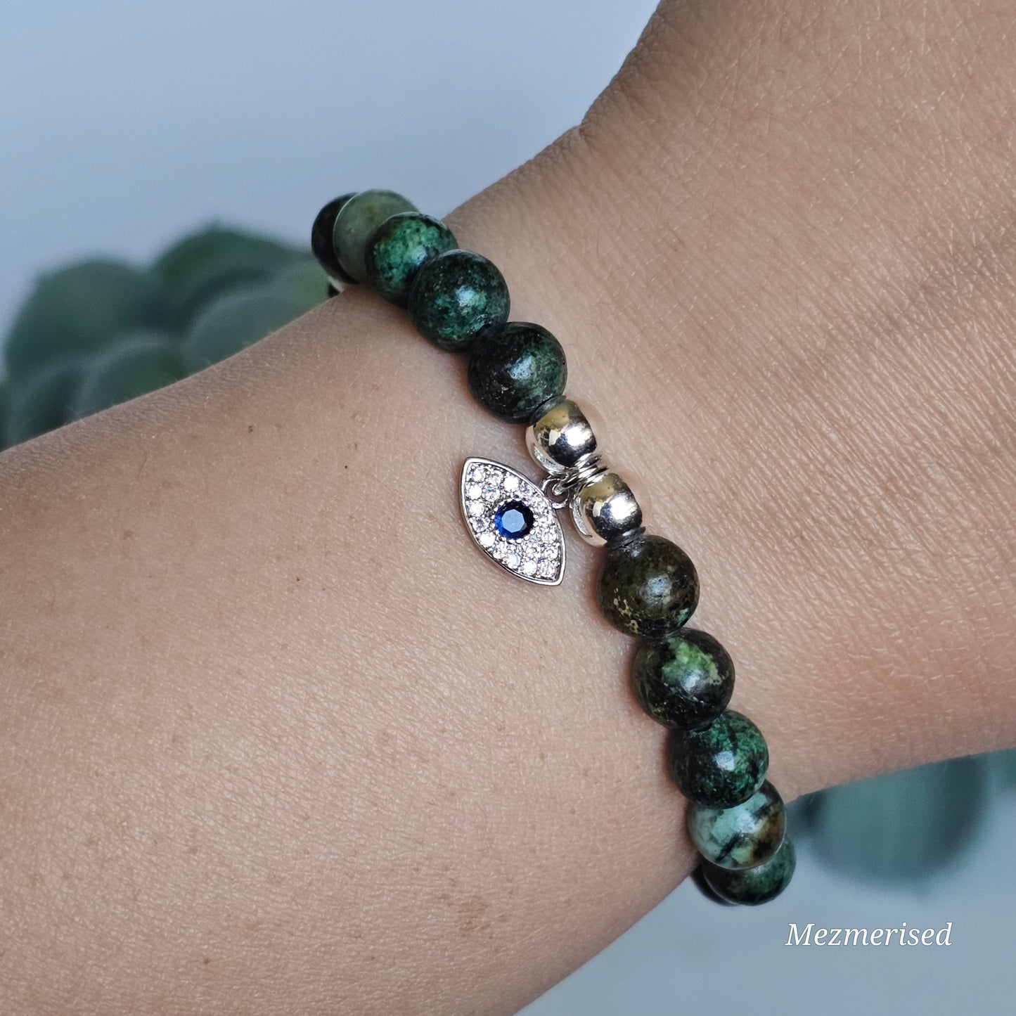 8mm African Turquoise and silver plated Hematite bead stretch bracelet with your choice of charm.