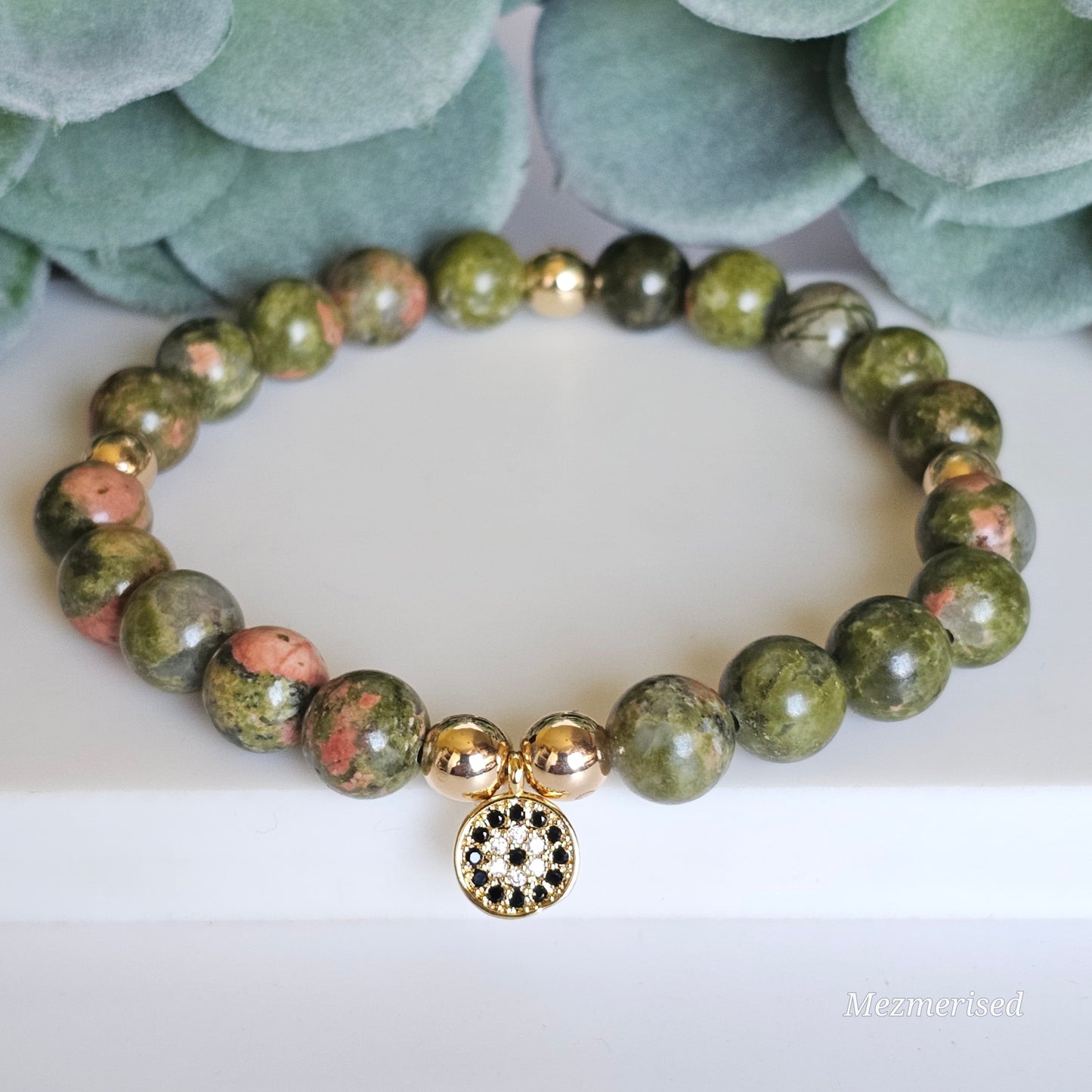 8mm Unakite and gold plated Hematite bead stretch bracelet with your choice of charm.