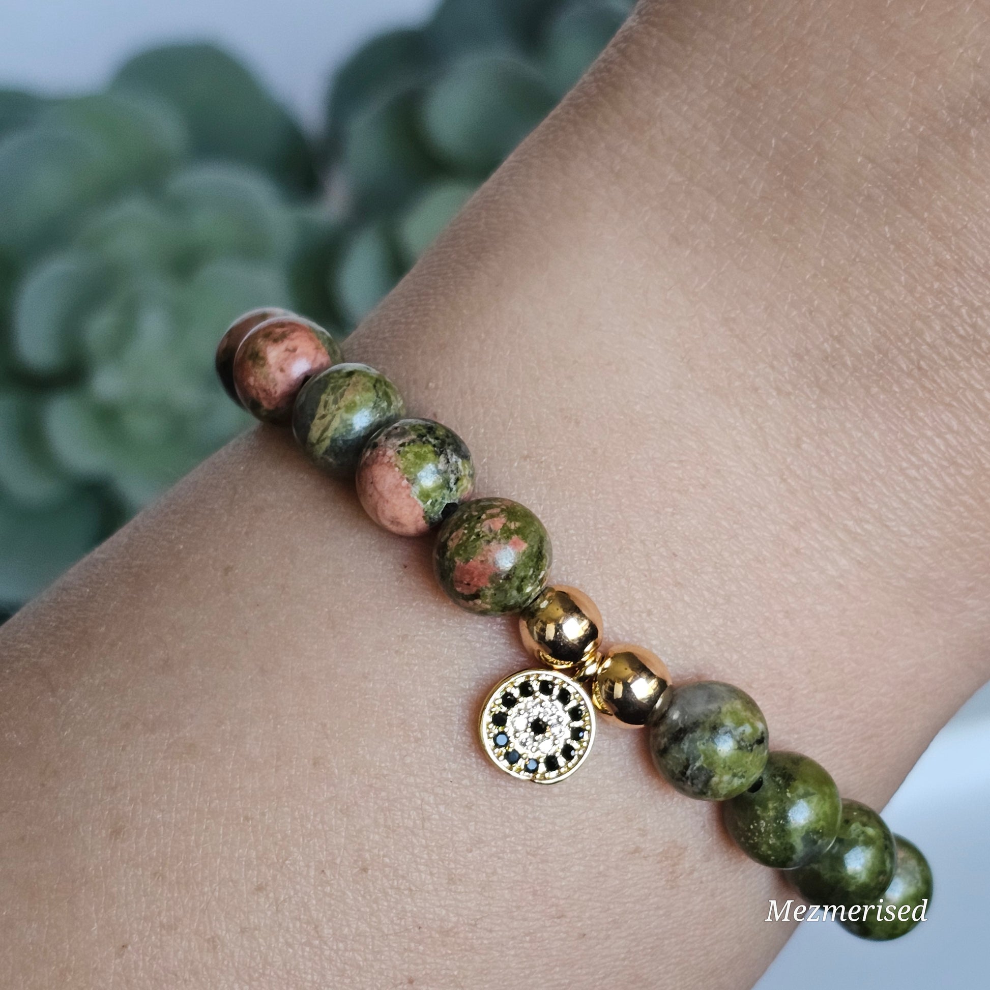 8mm Unakite and gold plated Hematite bead stretch bracelet with your choice of charm.