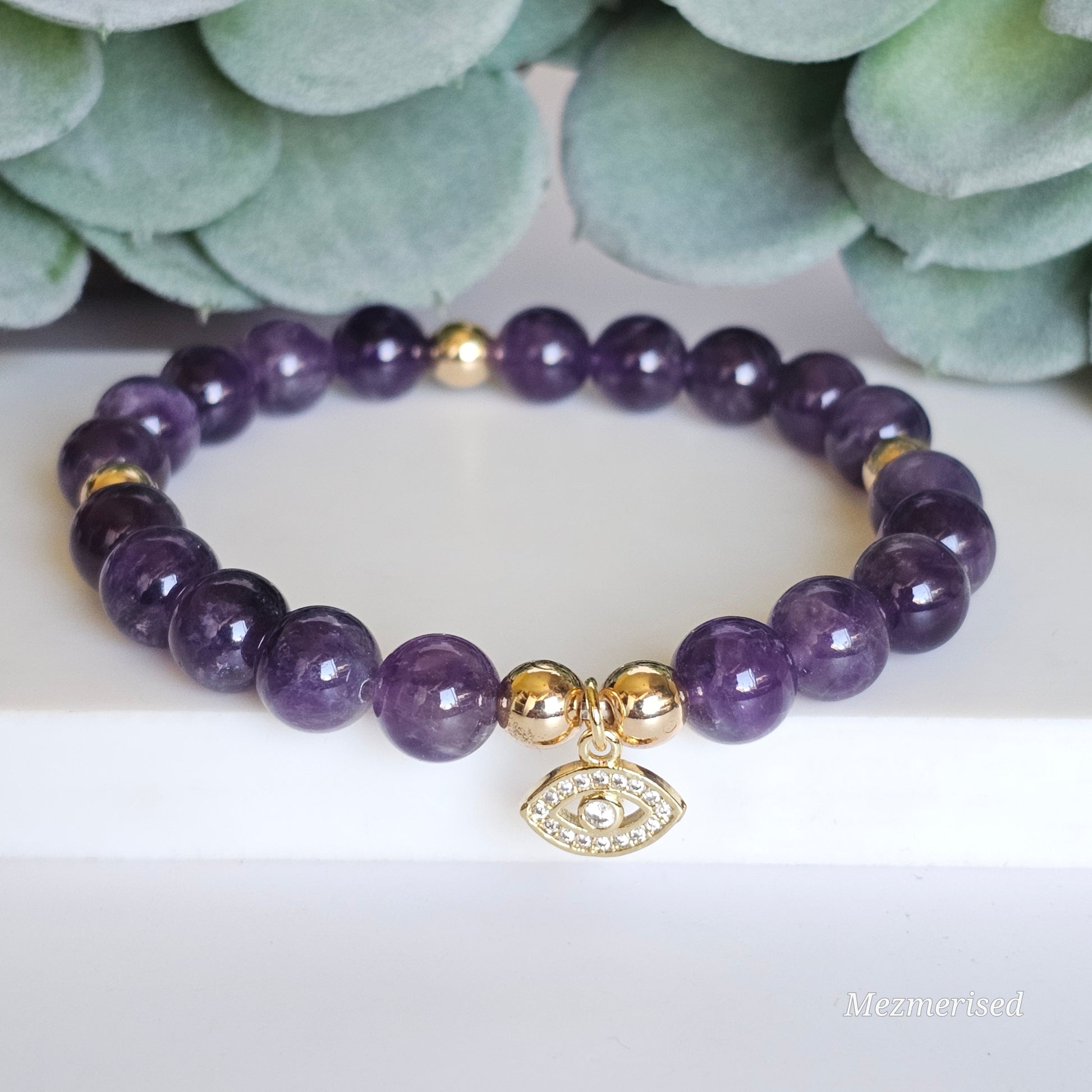 8mm Amethyst and gold plated Hematite bead stretch bracelet with your choice of charm.