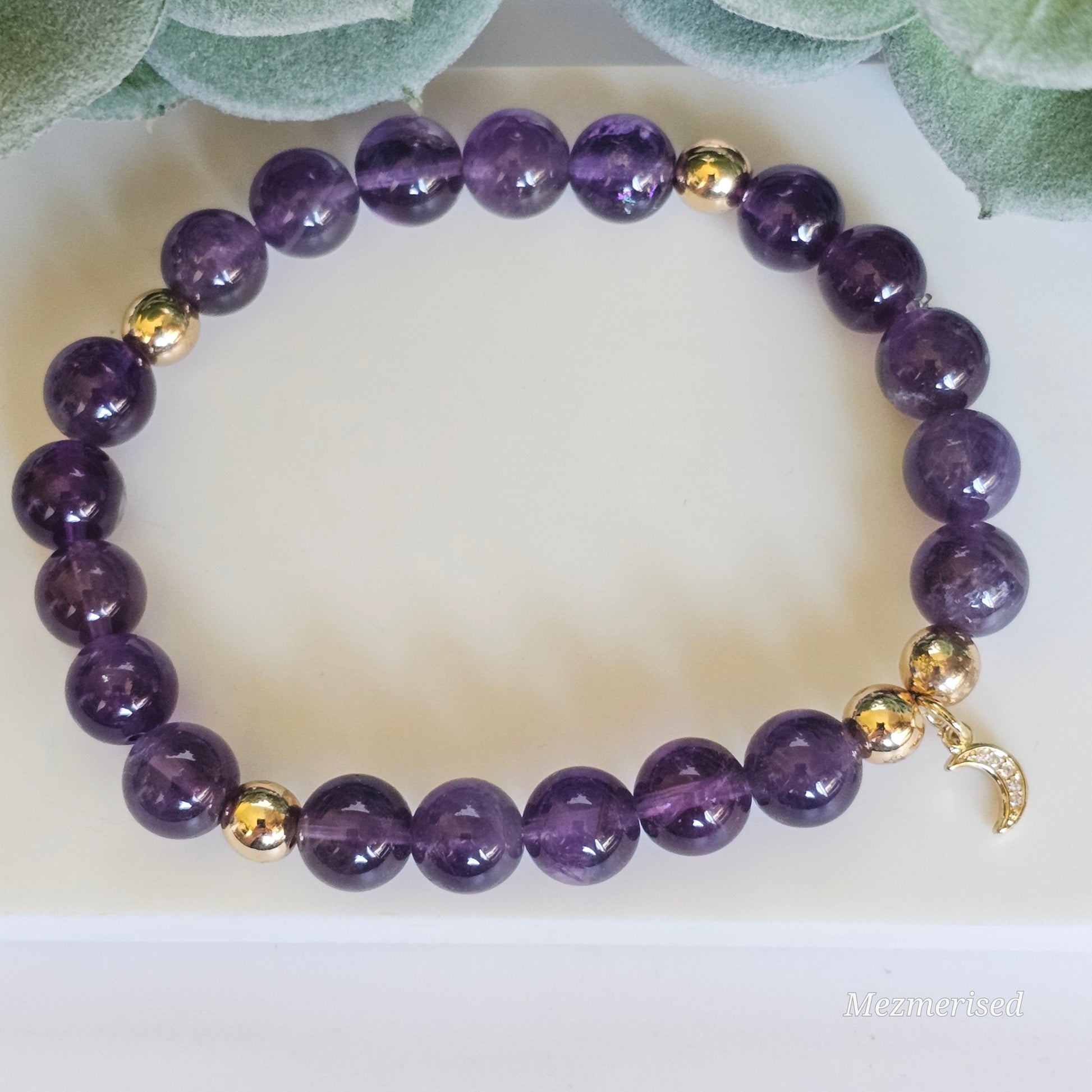 8mm Amethyst and gold plated Hematite bead stretch bracelet with your choice of charm.