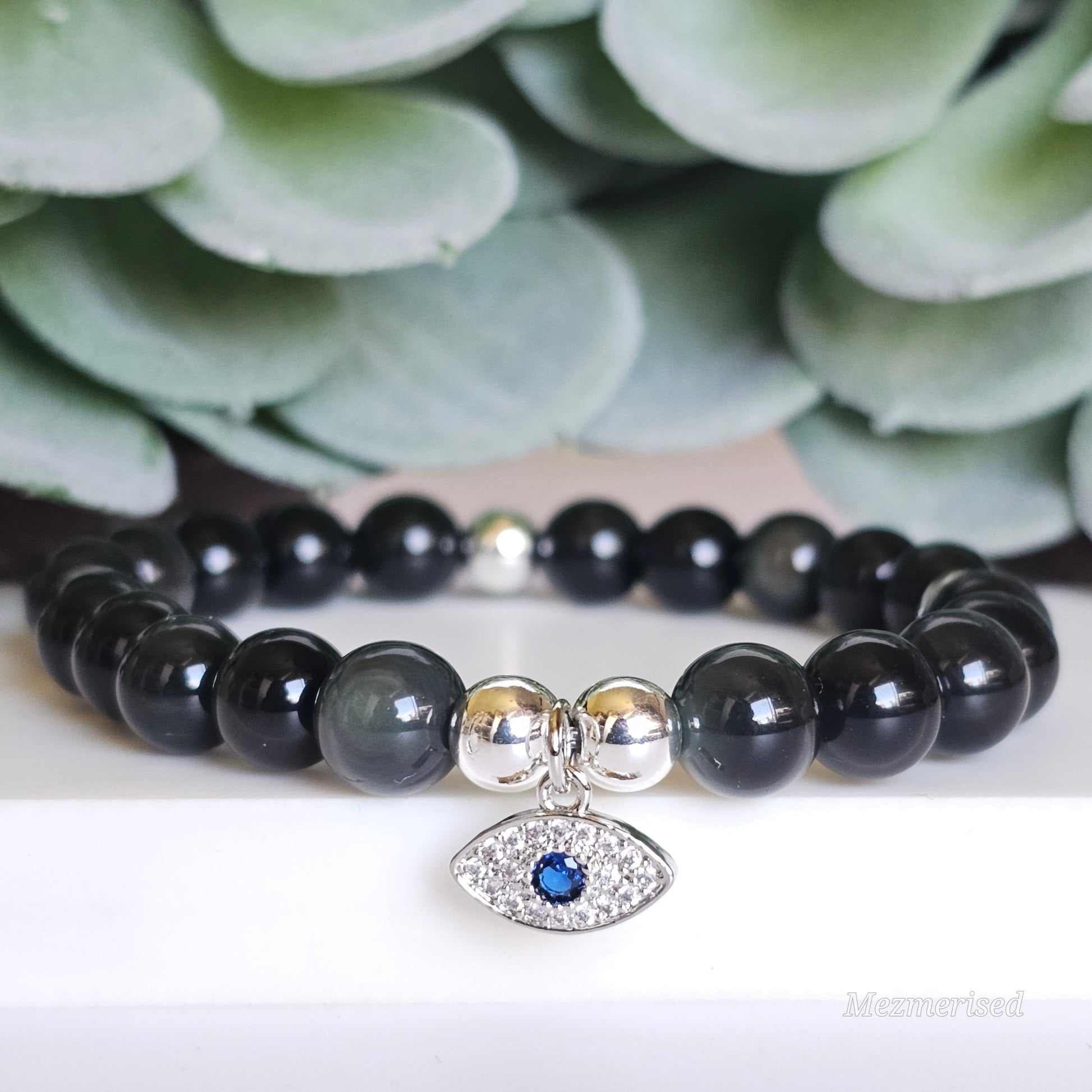 8mm AA grade Rainbow Obsidian and silver plated Hematite bead stretch bracelet with your choice of charm.