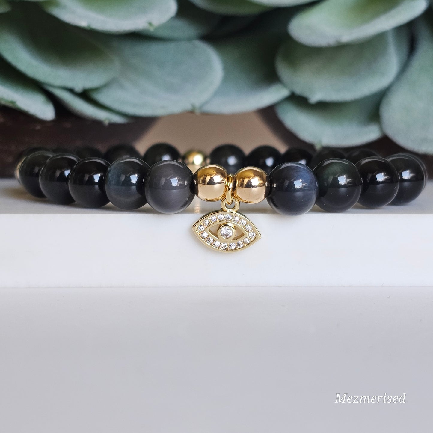 8mm AAA grade Rainbow Obsidian and gold plated Hematite bead stretch bracelet with your choice of charm.