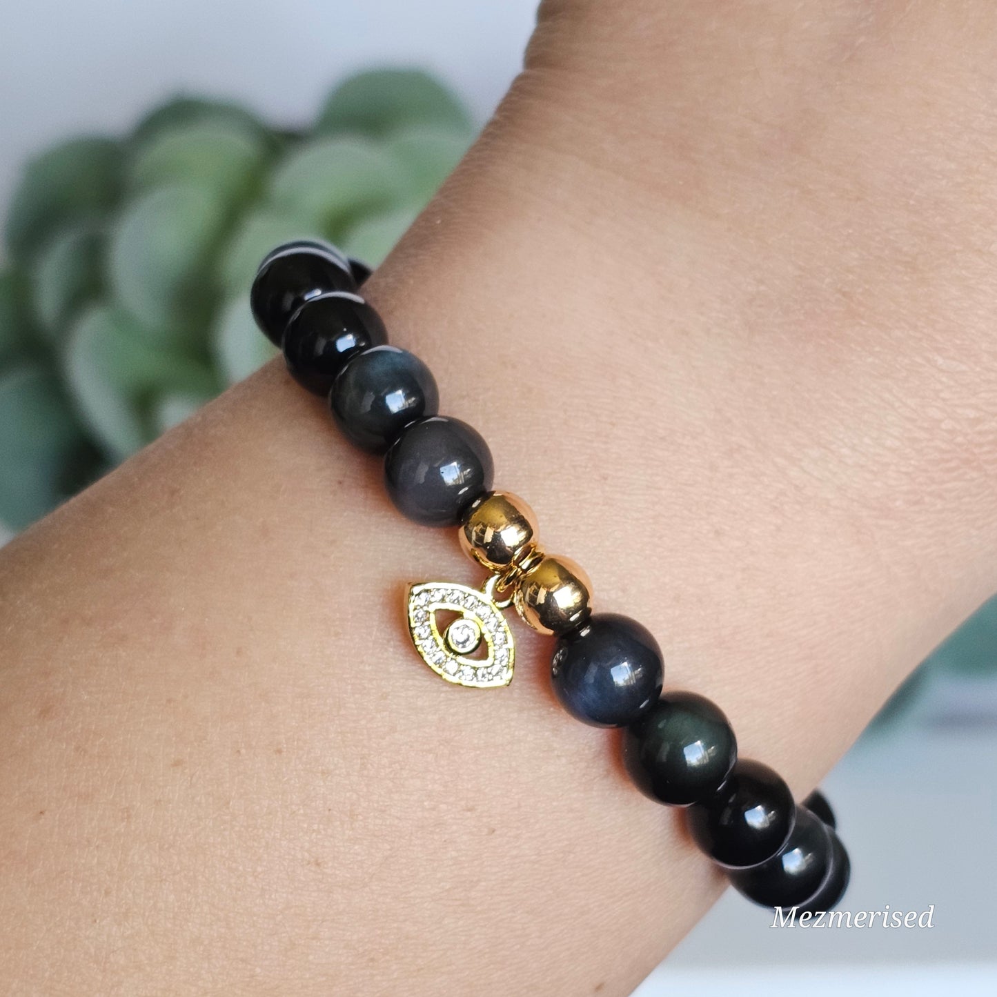 8mm AAA grade Rainbow Obsidian and gold plated Hematite bead stretch bracelet with your choice of charm.