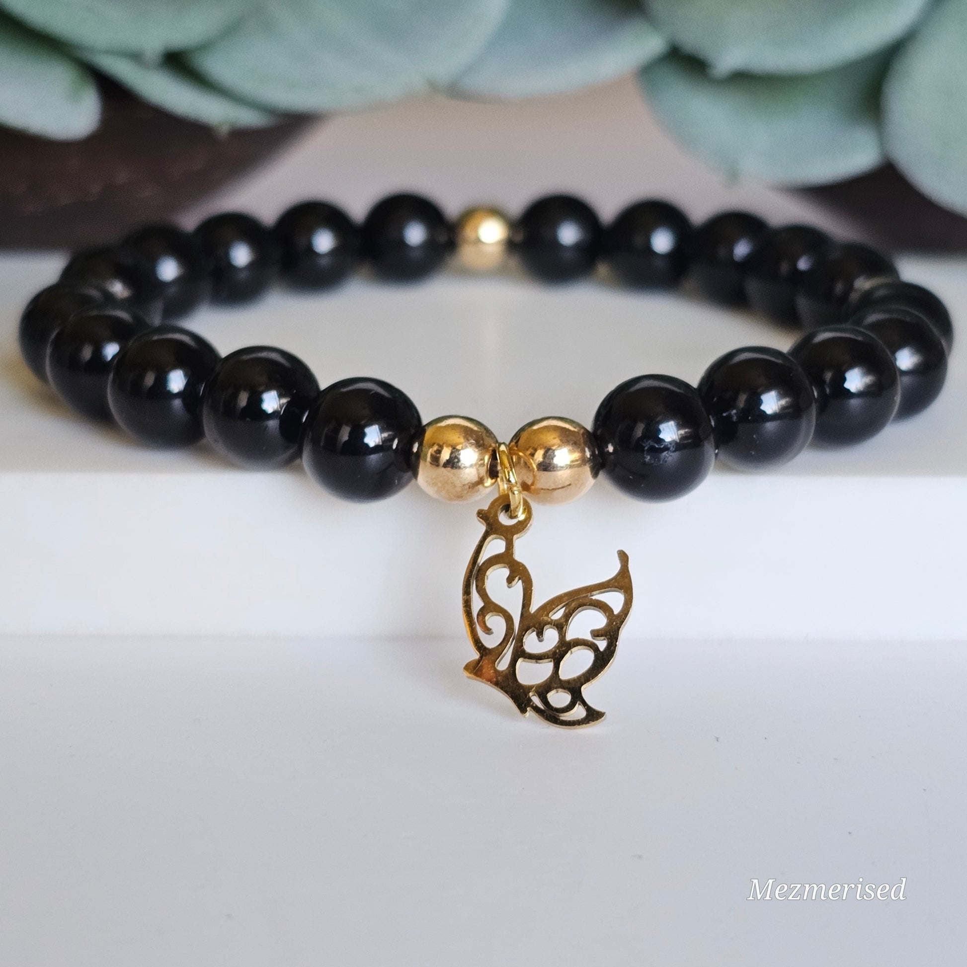 8mm A grade Black Tourmaline and gold plated Hematite bead stretch bracelet with your choice of charm.