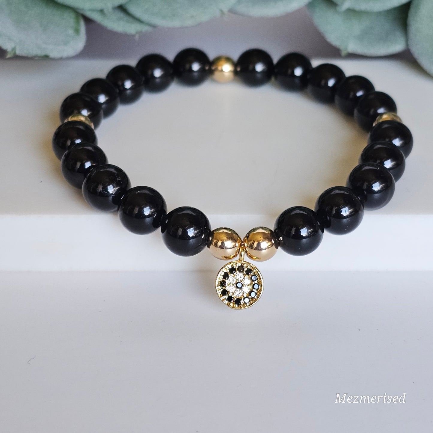 8mm A grade Black Tourmaline and gold plated Hematite bead stretch bracelet with your choice of charm.