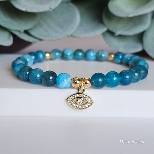 6mm A grade blue Apatite and gold plated Hematite bead stretch bracelet with your choice of charm.