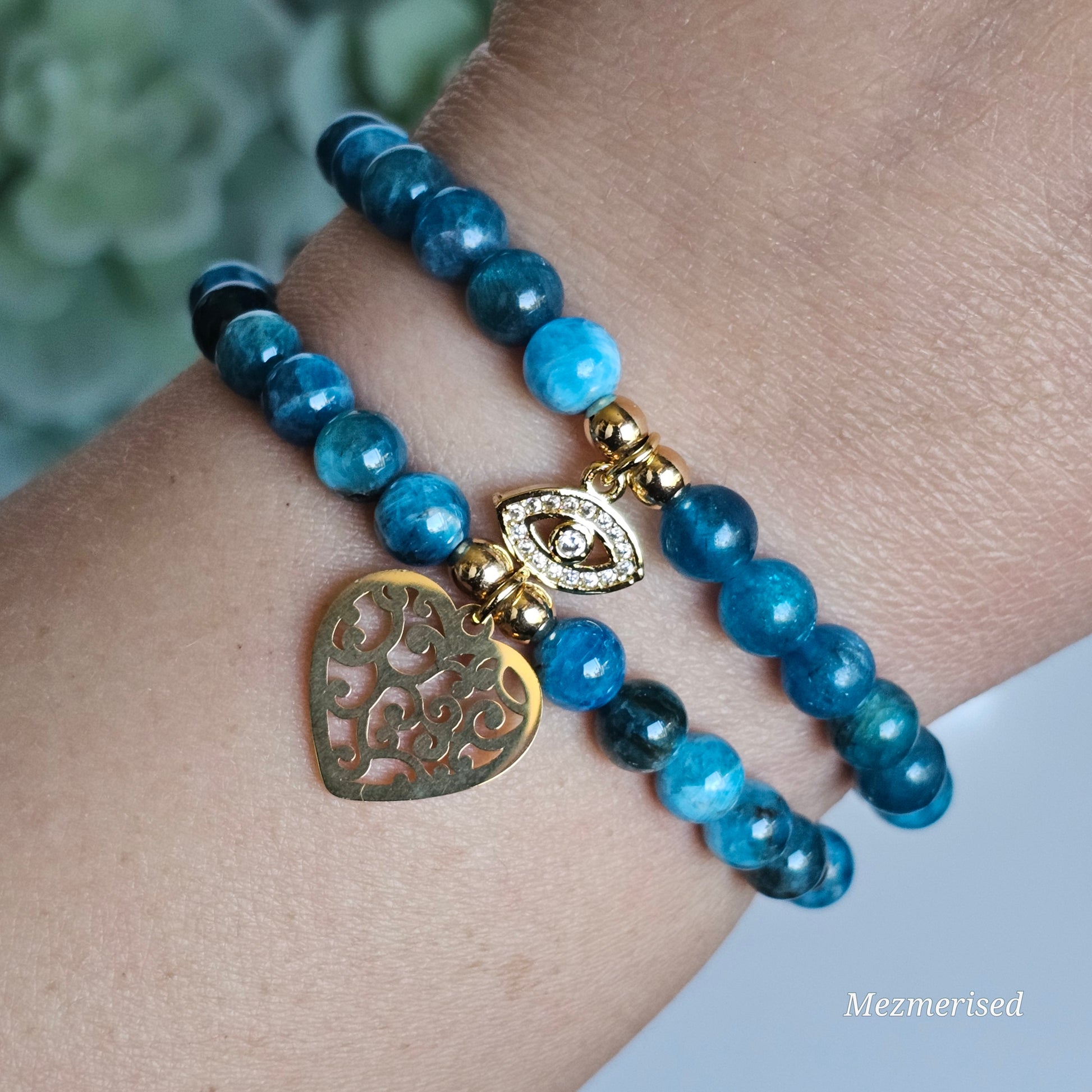 6mm A grade blue Apatite and gold plated Hematite bead stretch bracelet with your choice of charm.