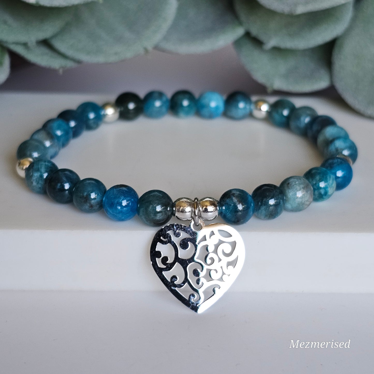 6mm A grade blue Apatite and silver plated Hematite bead stretch bracelet with your choice of charm.