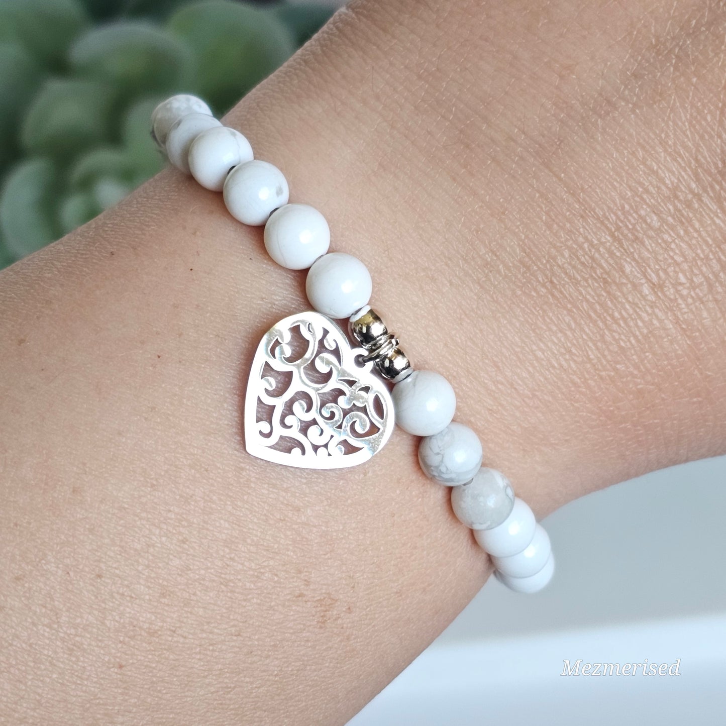 6mm Howlite and silver plated Hematite bead stretch bracelet with your choice of charm.