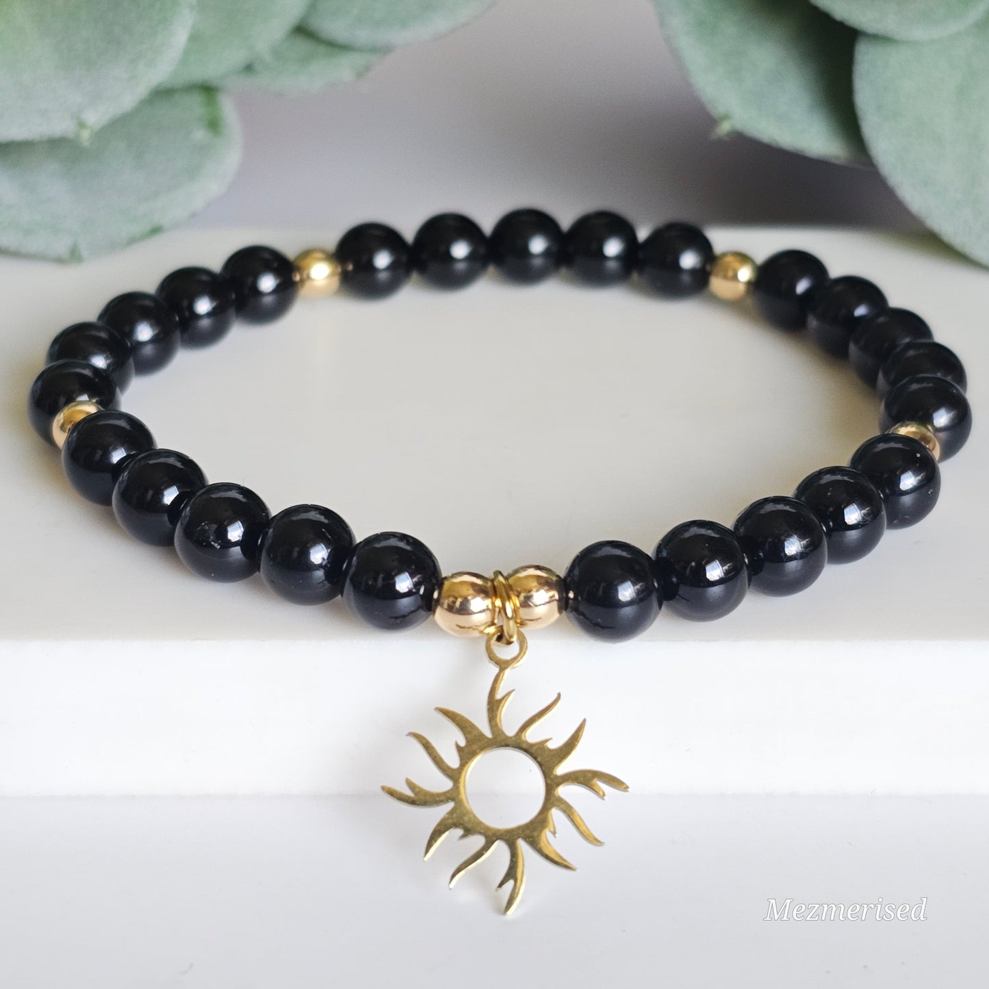 6mm A grade Black Tourmaline and gold plated Hematite bead stretch bracelet with your choice of charm.