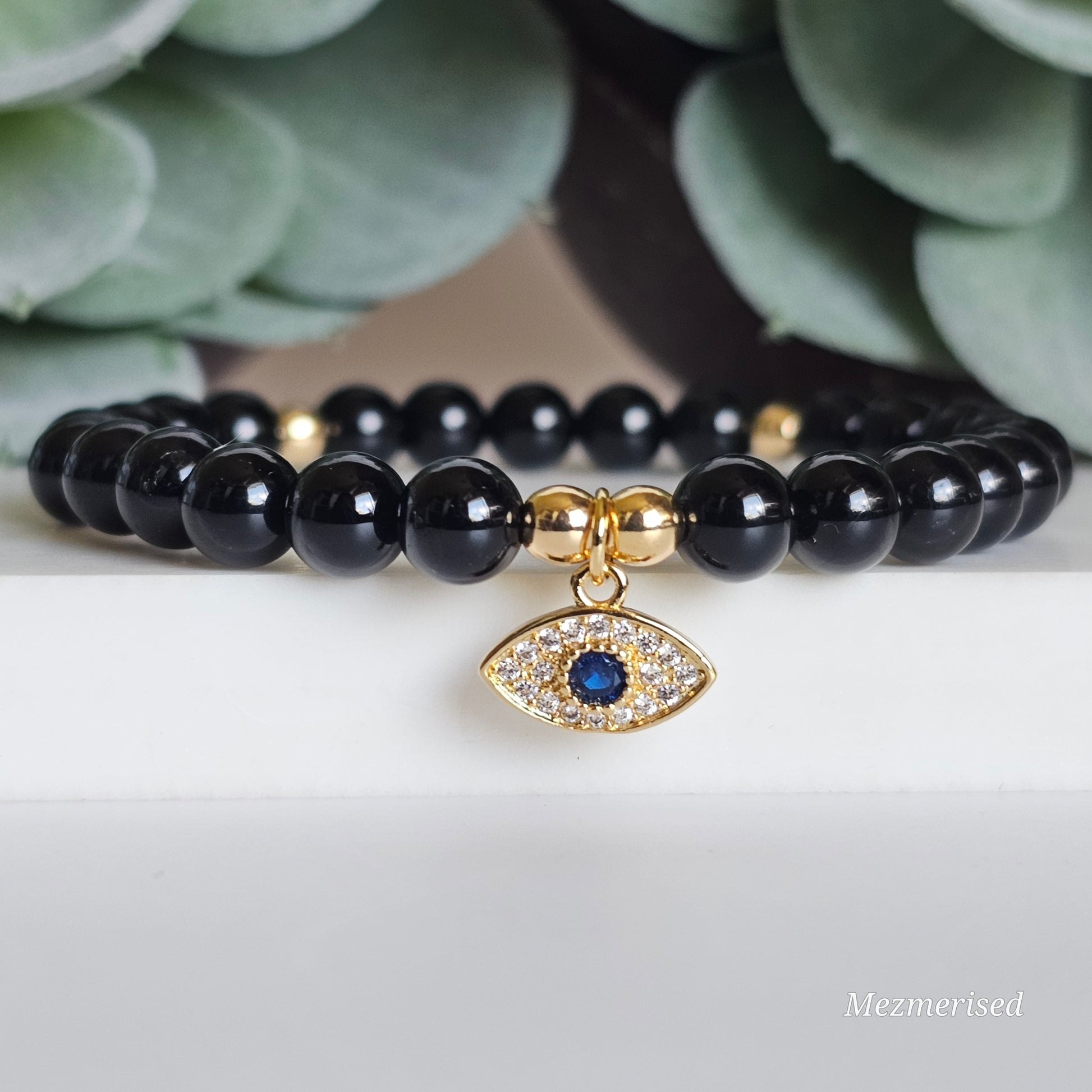 6mm A grade Black Tourmaline and gold plated Hematite bead stretch bracelet with your choice of charm.