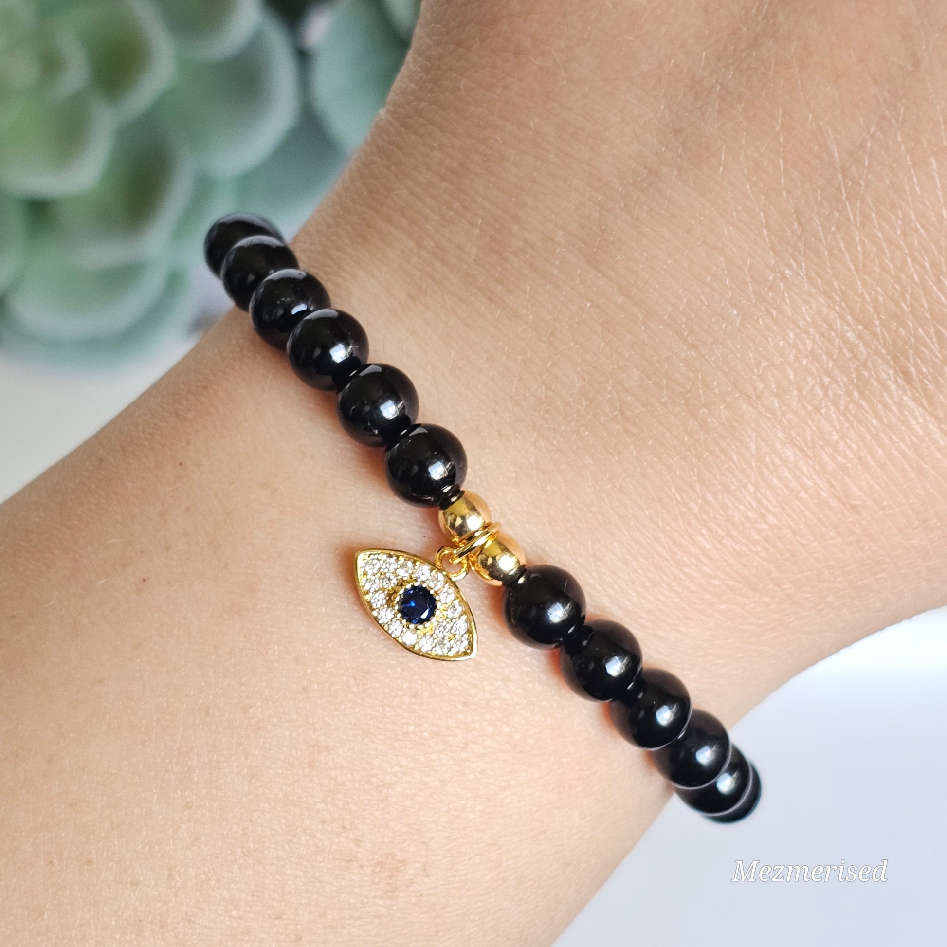 6mm A grade Black Tourmaline and gold plated Hematite bead stretch bracelet with your choice of charm.