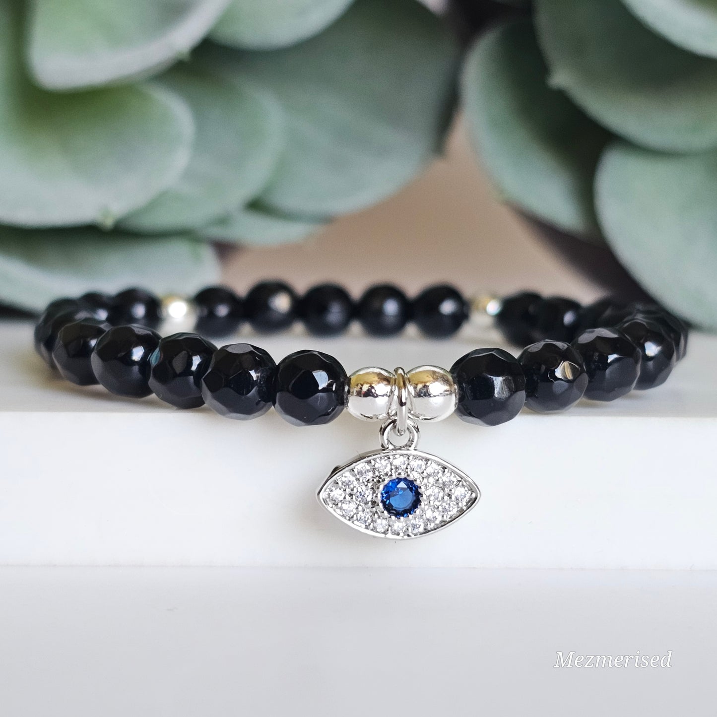 6mm faceted Onyx and silver plated Hematite bead stretch bracelet with your choice of charm.