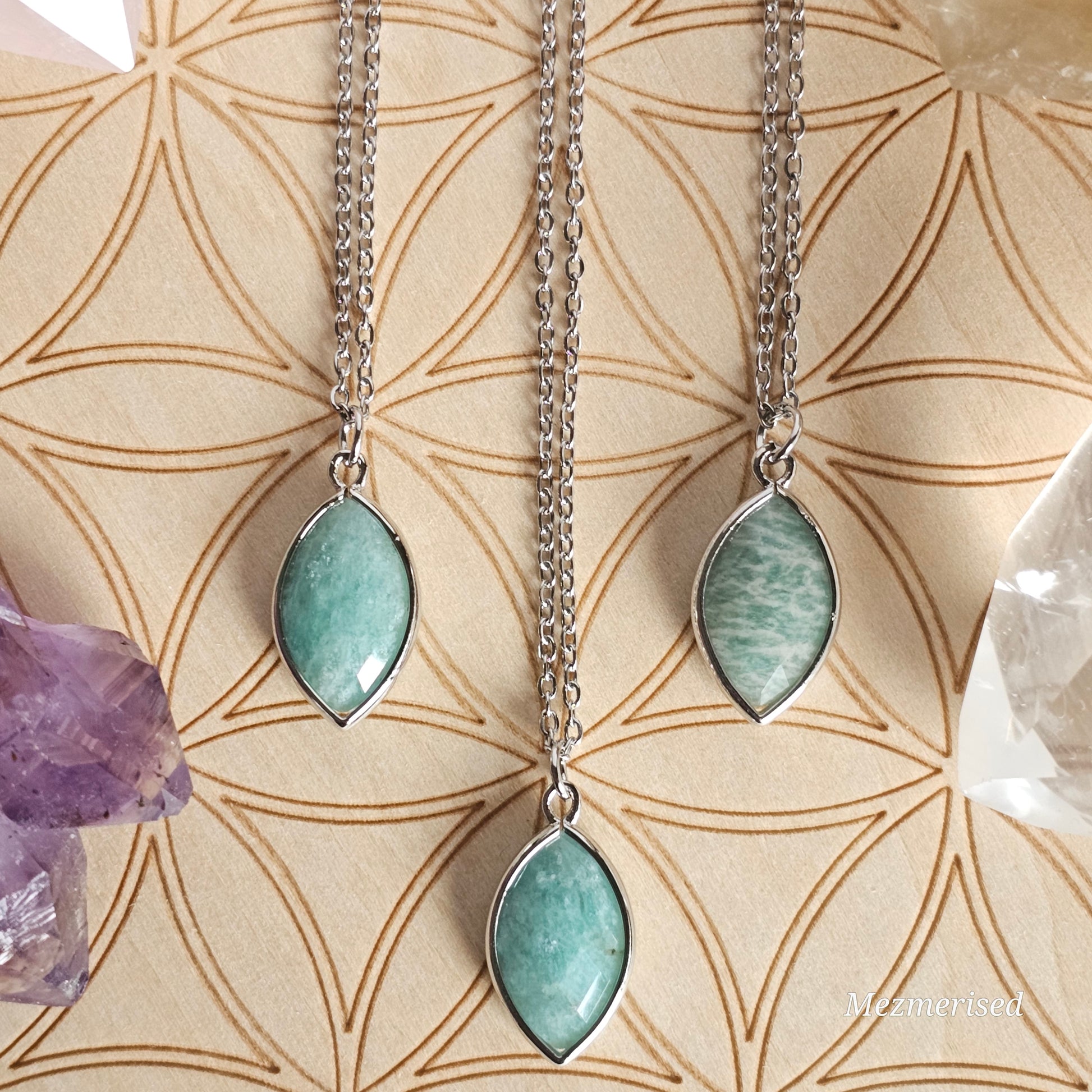 Faceted Amazonite marquise pendant suspended from a silver coloured stainless steel chain.