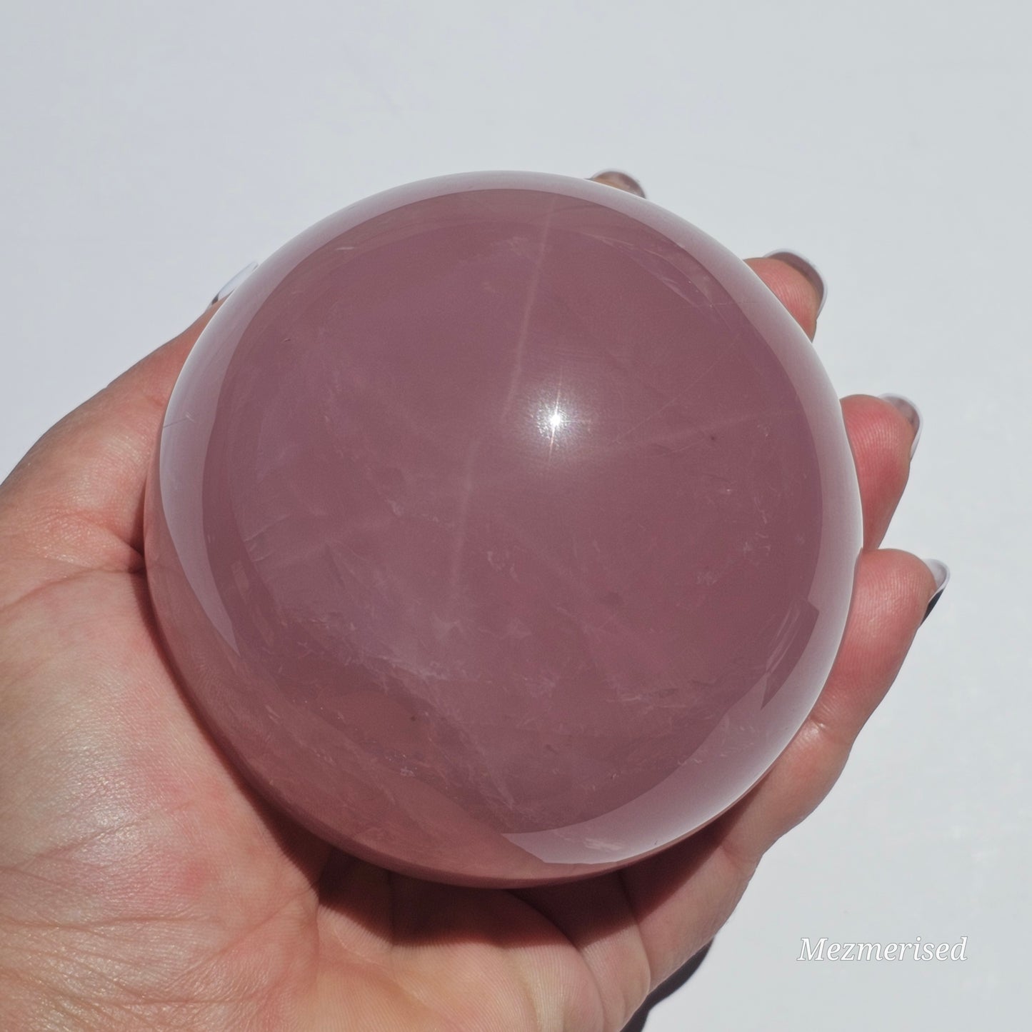 A stunning dark Rose Quartz sphere with beautiful asterism