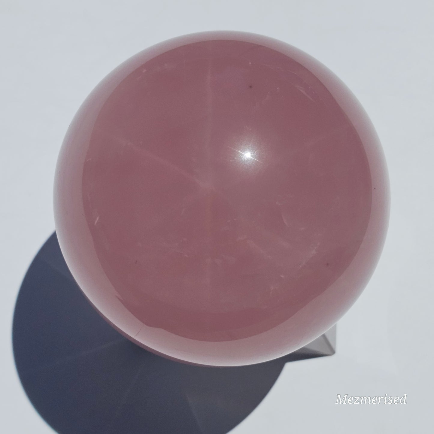 A stunning dark Rose Quartz sphere with beautiful asterism