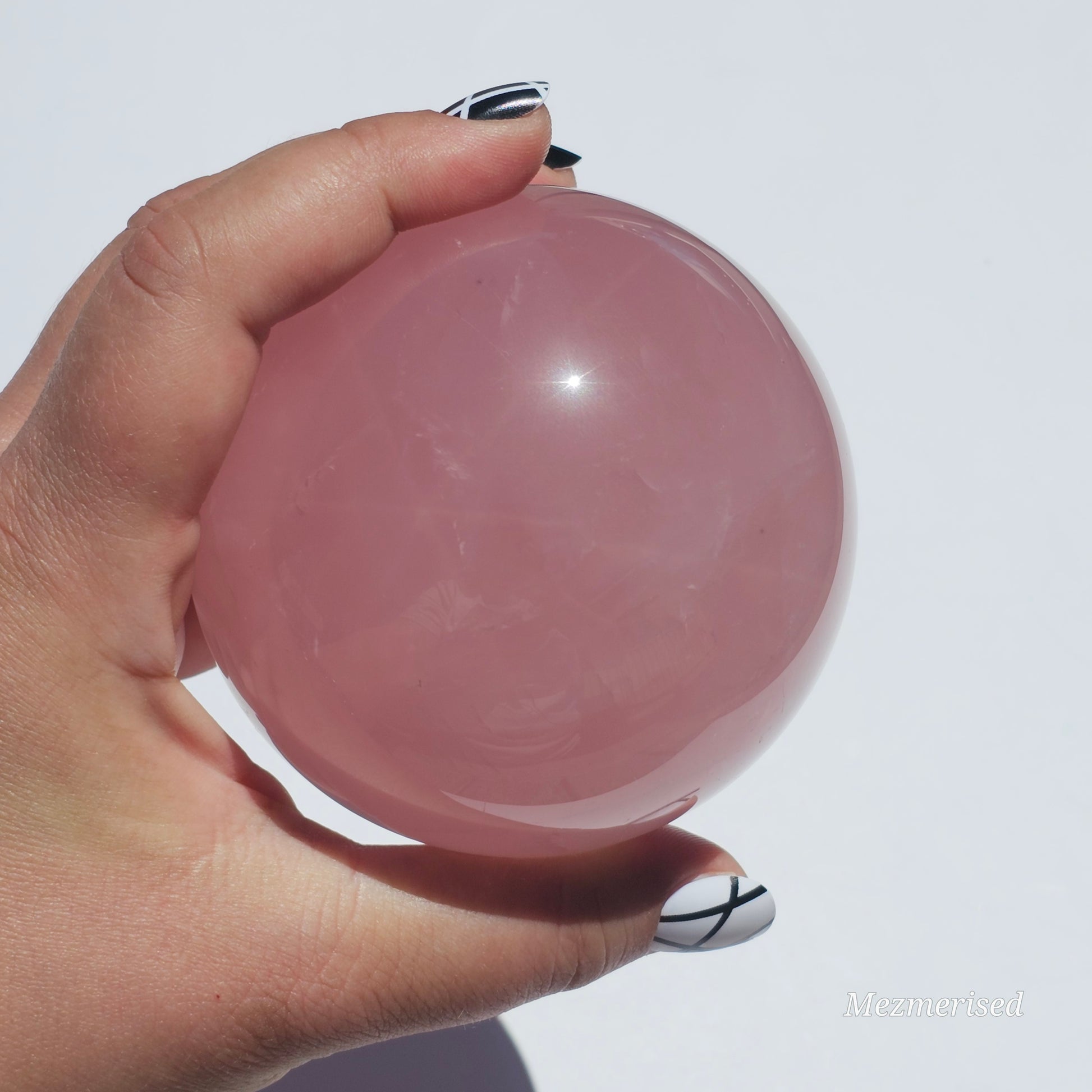 A stunning dark Rose Quartz sphere with beautiful asterism