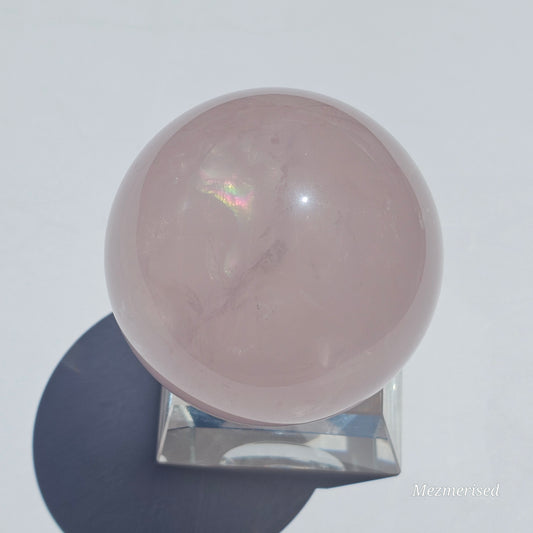 A beautiful Rose Quartz sphere with flash and gorgeous rainbows