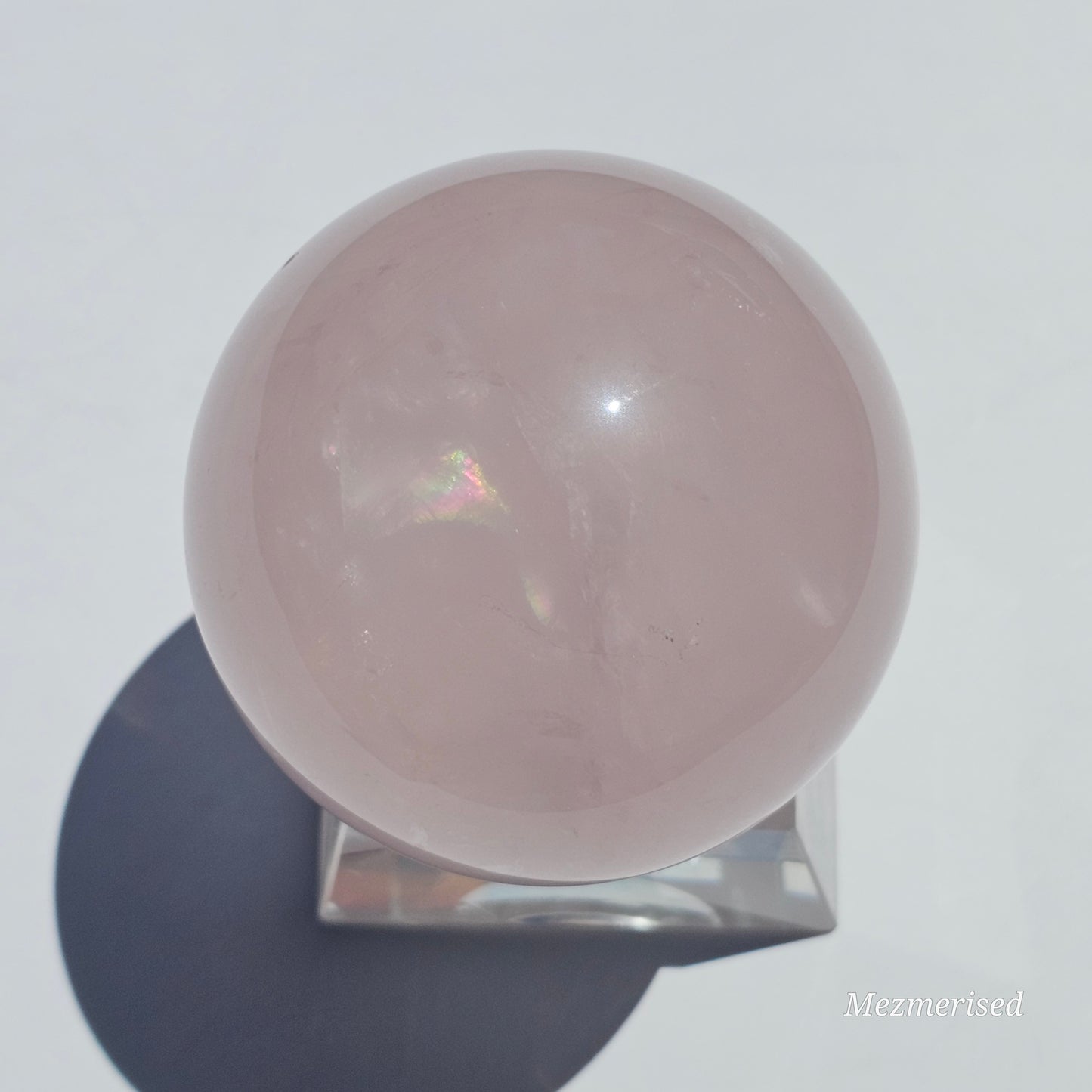 A beautiful Rose Quartz sphere with flash and gorgeous rainbows