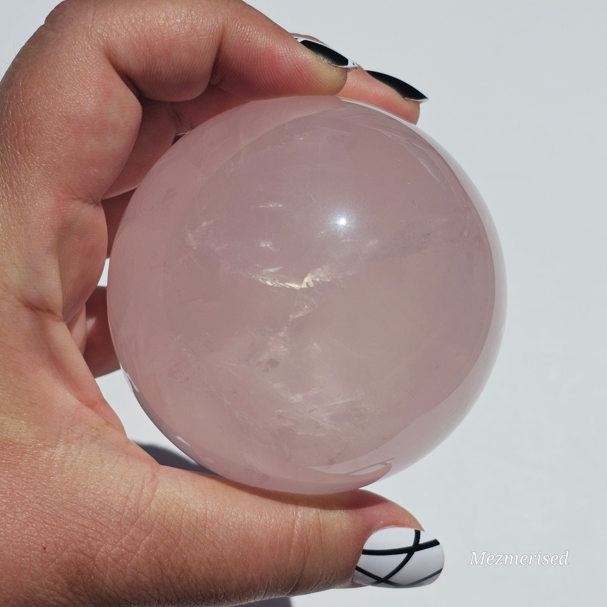 A beautiful Rose Quartz sphere with flash and gorgeous rainbows