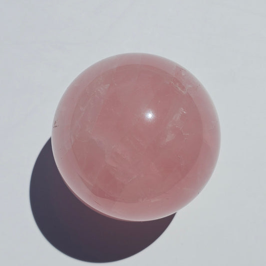 A beautiful Rose Quartz sphere with asterism and gorgeous rainbows