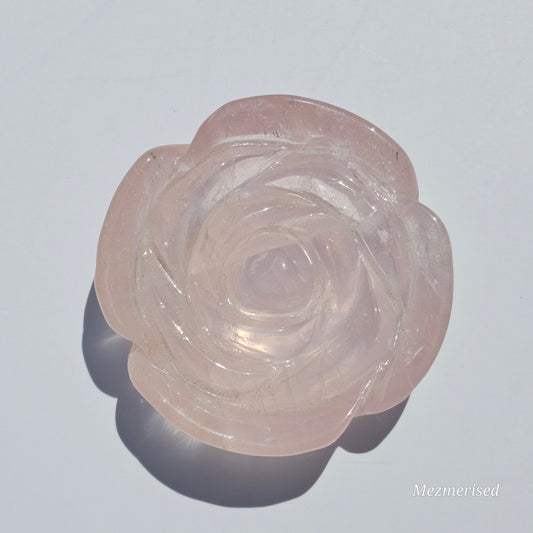 A lovely rose carving from a gemmy Rose Quartz