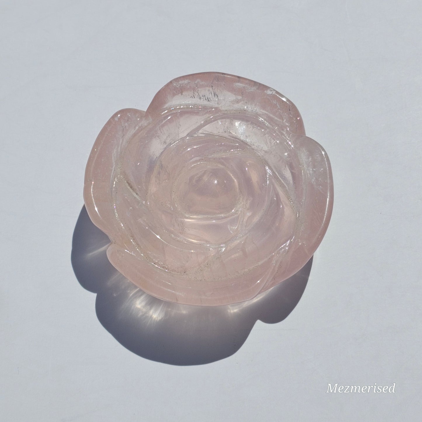 A lovely rose carving from a gemmy Rose Quartz