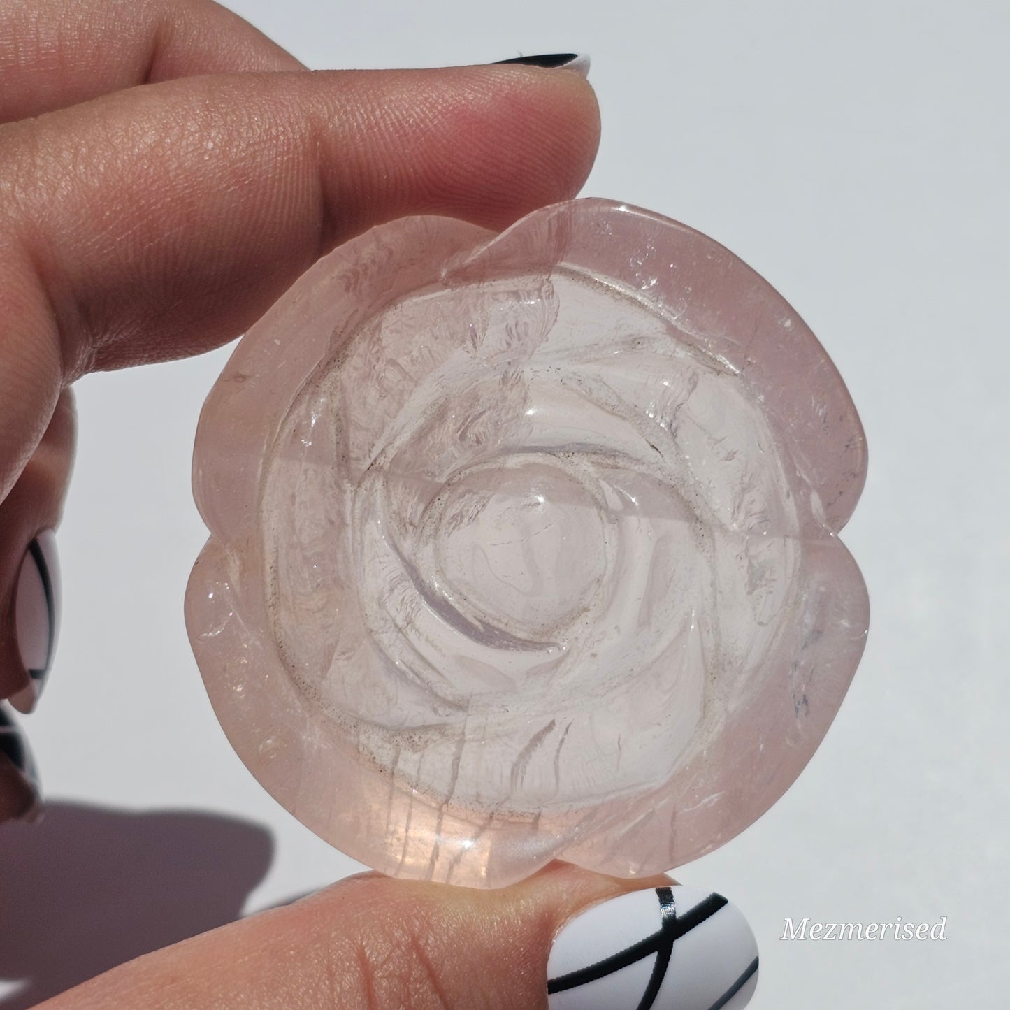 A lovely rose carving from a gemmy Rose Quartz