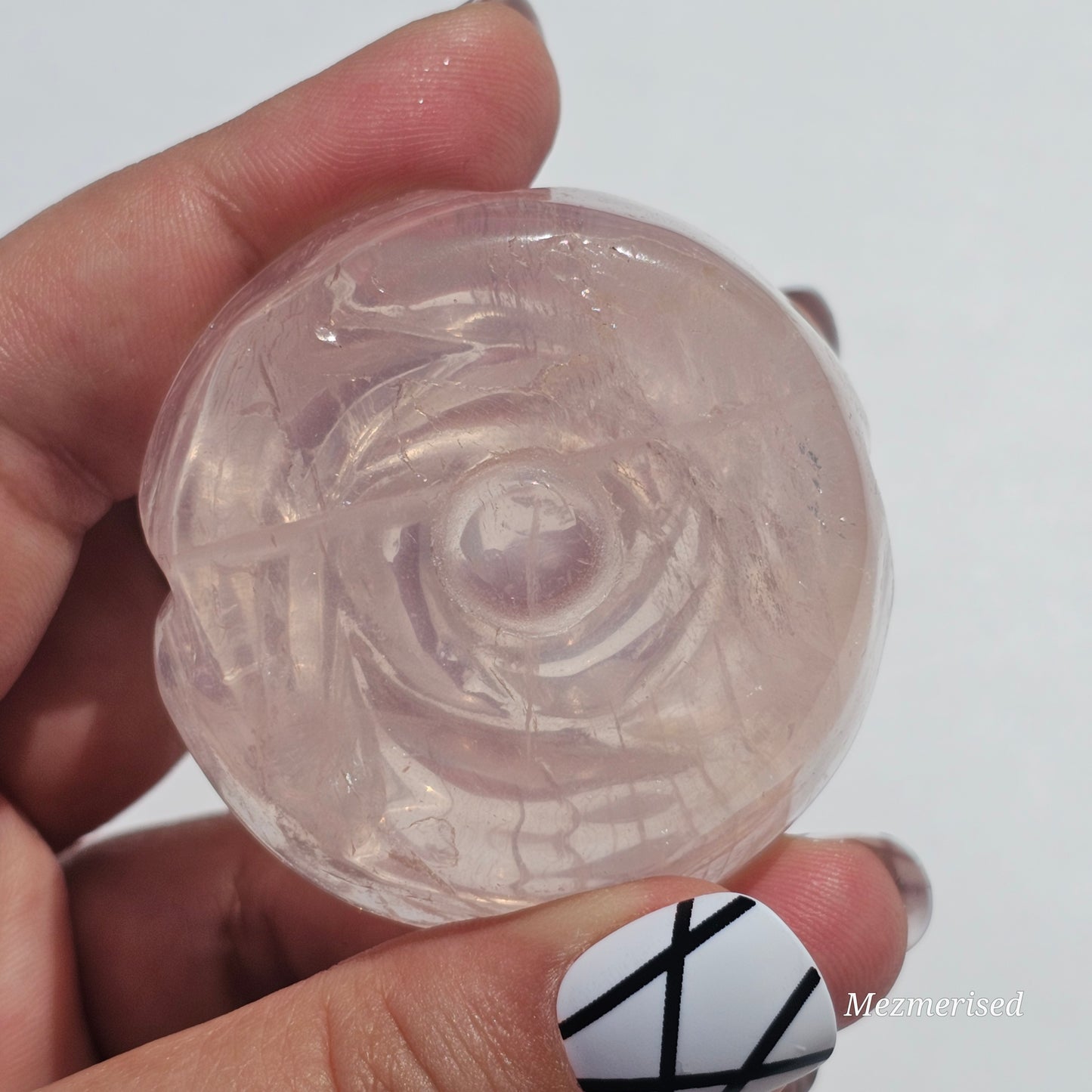 A lovely rose carving from a gemmy Rose Quartz