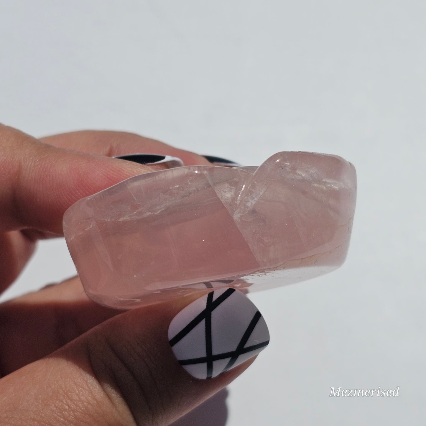 A lovely rose carving from a gemmy Rose Quartz