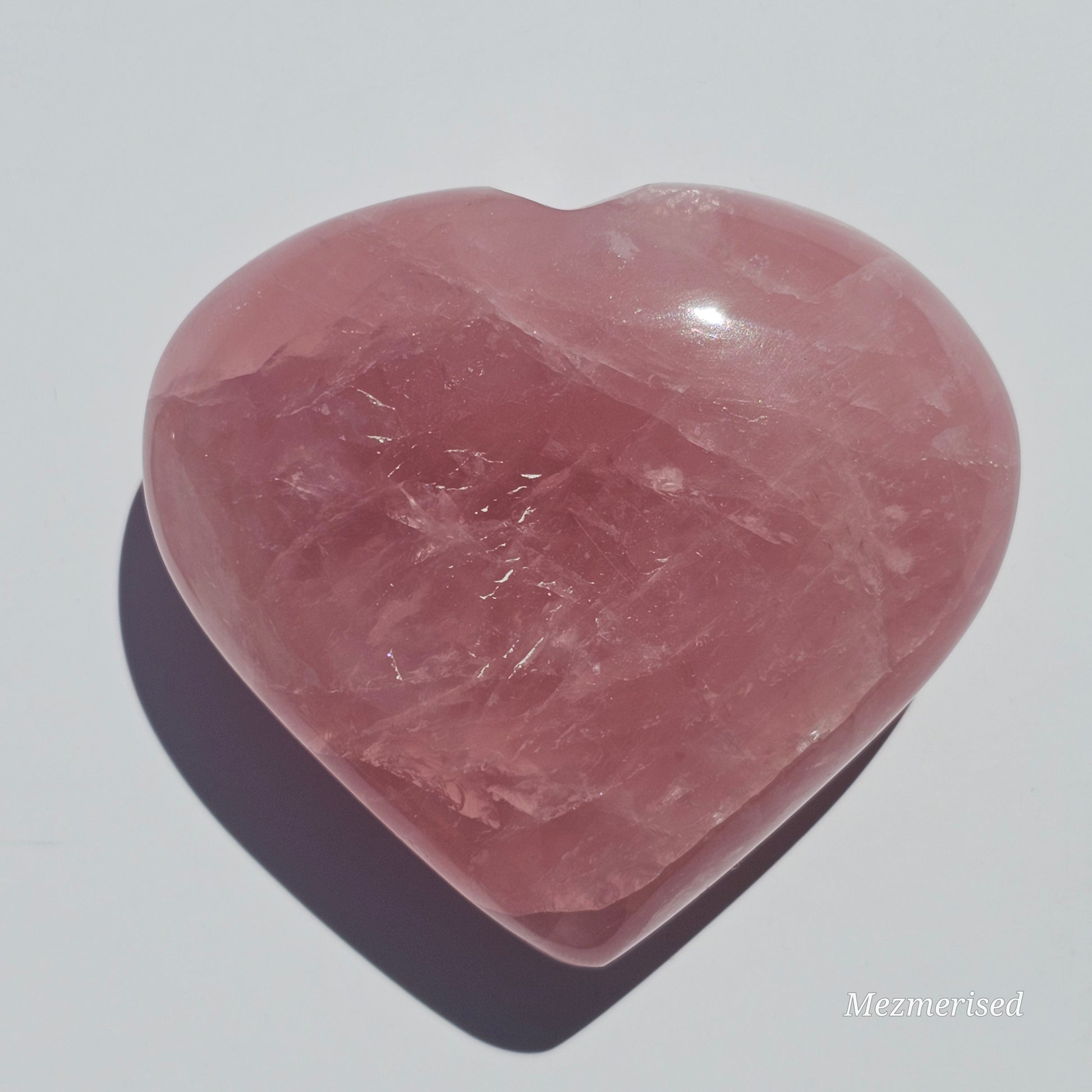 Beautifully carved dark pink puffy Rose Quartz heart.