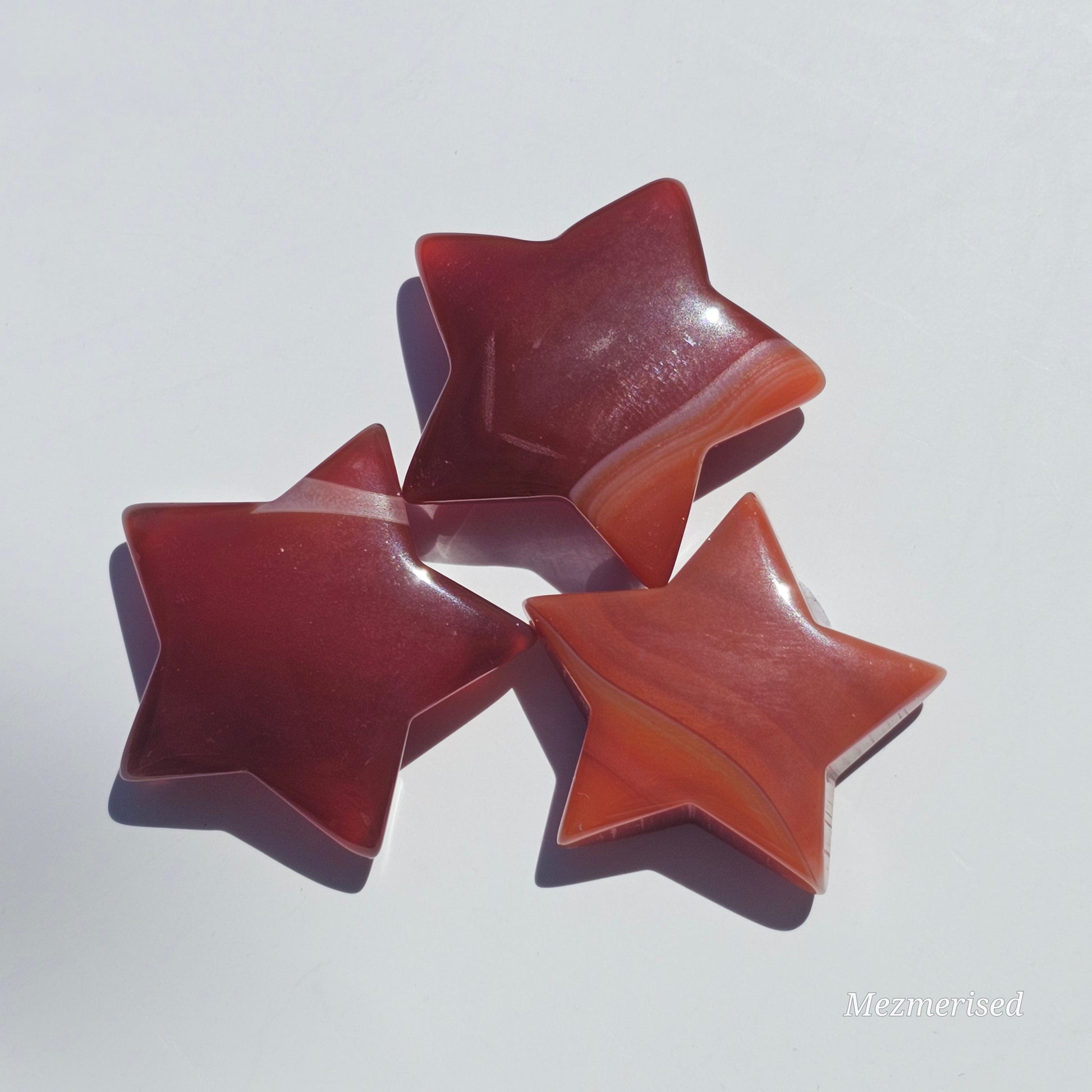 Small beautifully carved Carnelian stars.