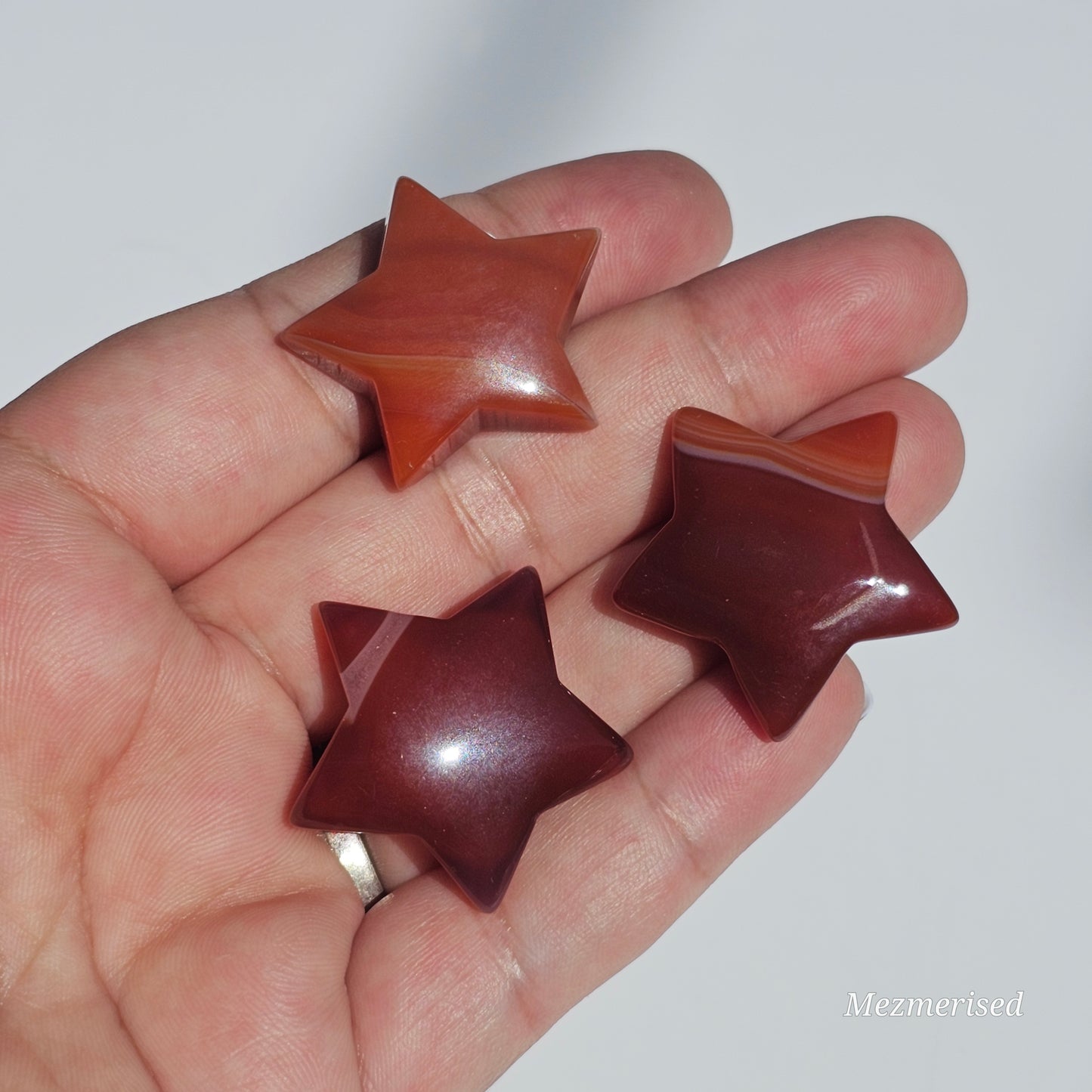 Small beautifully carved Carnelian stars.