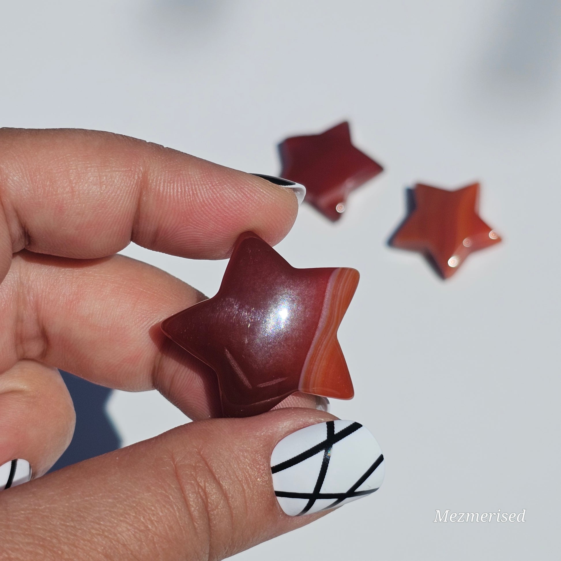 Small beautifully carved Carnelian stars.