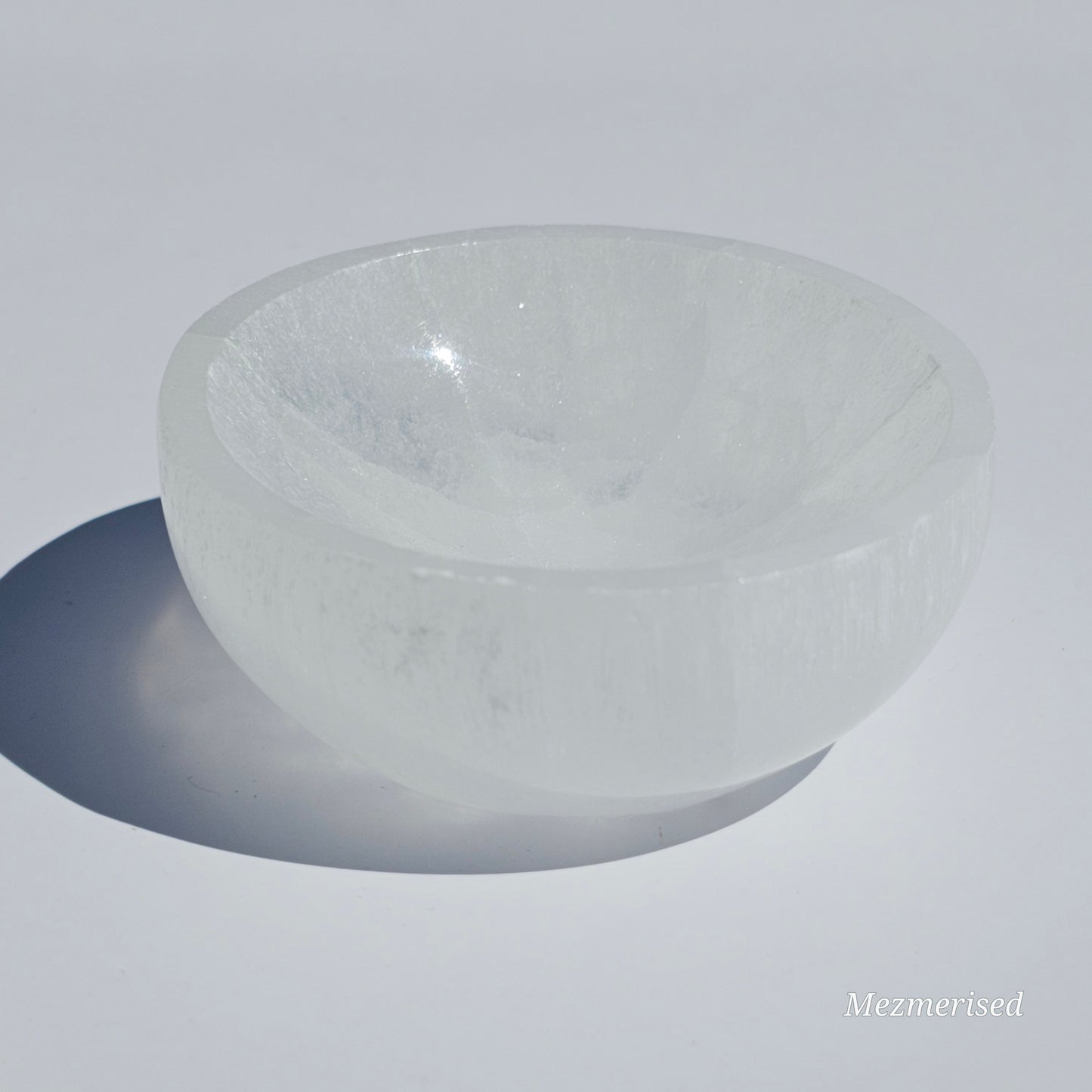 A small Selenite round dish perfect for cleansing your mini crystals.