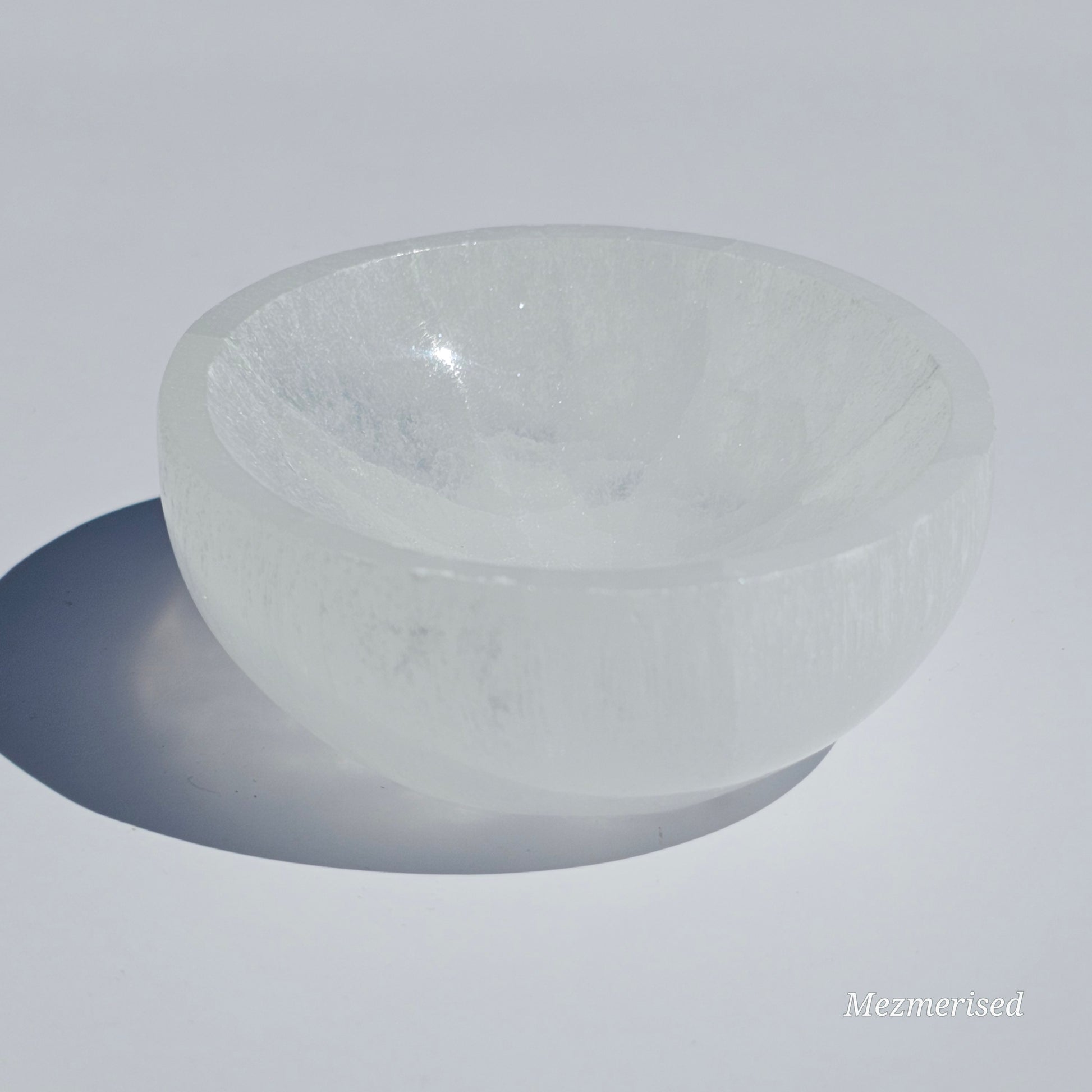 A small Selenite round dish perfect for cleansing your mini crystals.