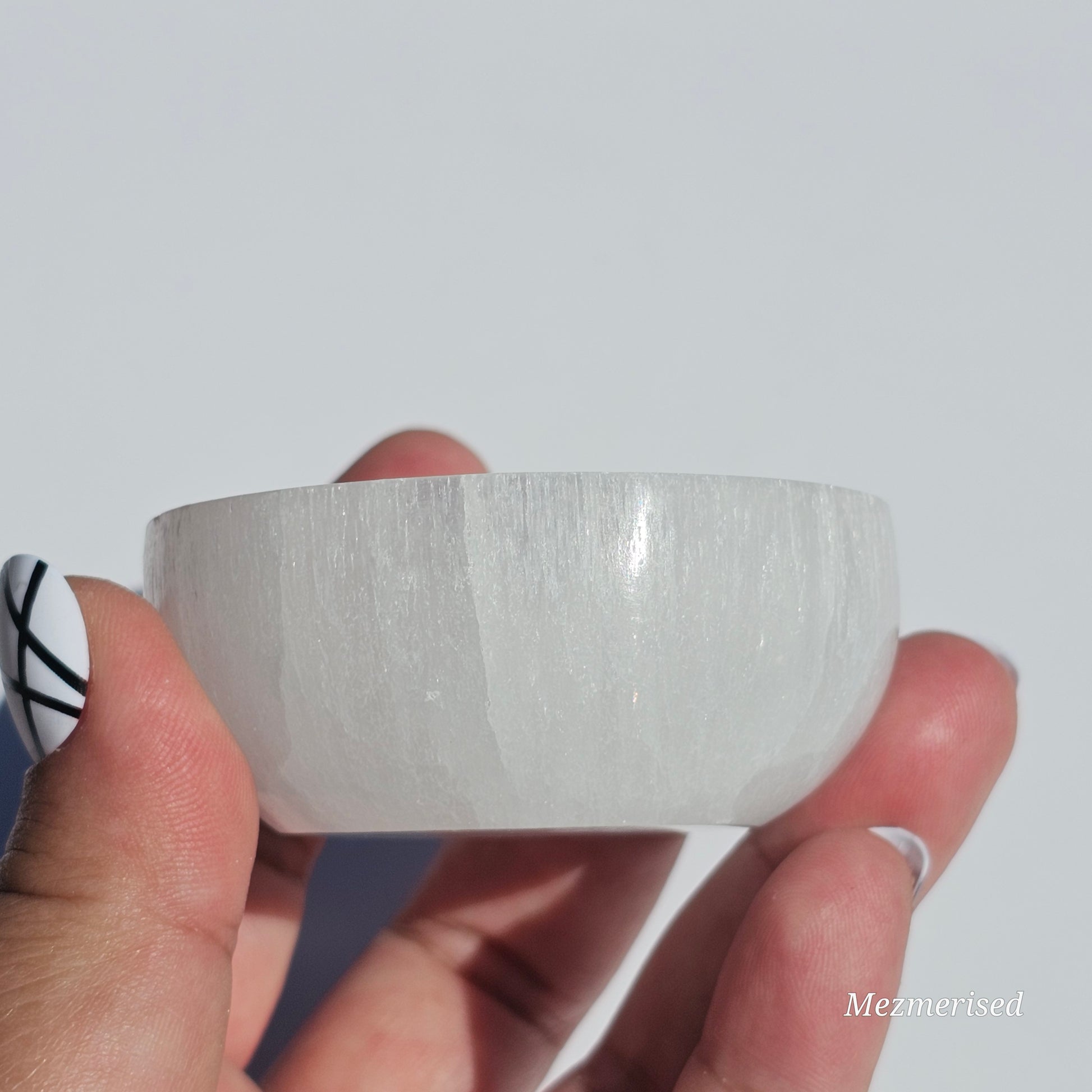 A small Selenite round dish perfect for cleansing your mini crystals.