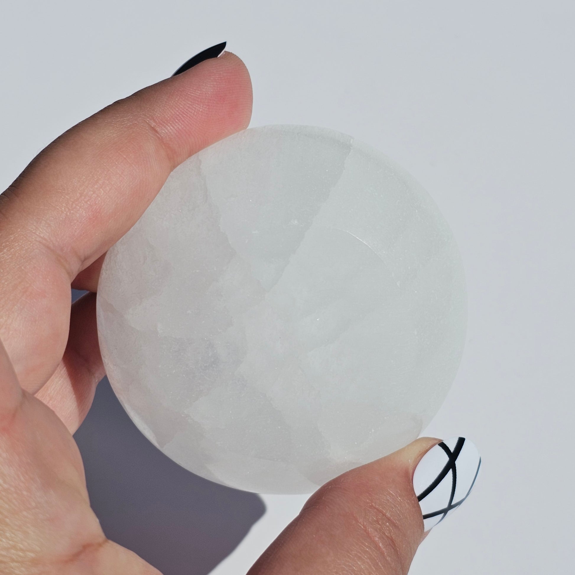 A small Selenite round dish perfect for cleansing your mini crystals.